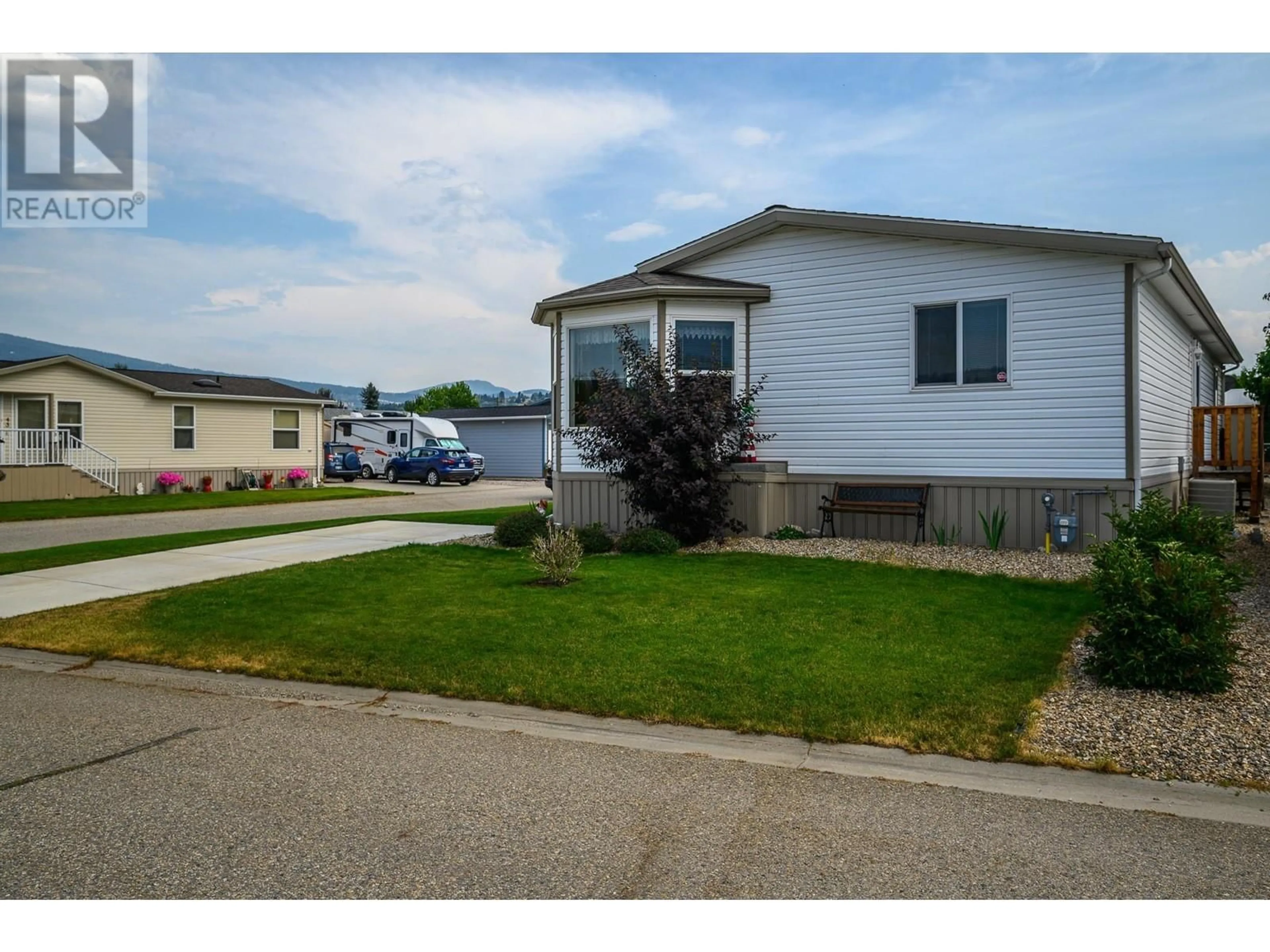 Home with vinyl exterior material, street for 77 - 12560 WESTSIDE ROAD, Vernon British Columbia V1H1S9