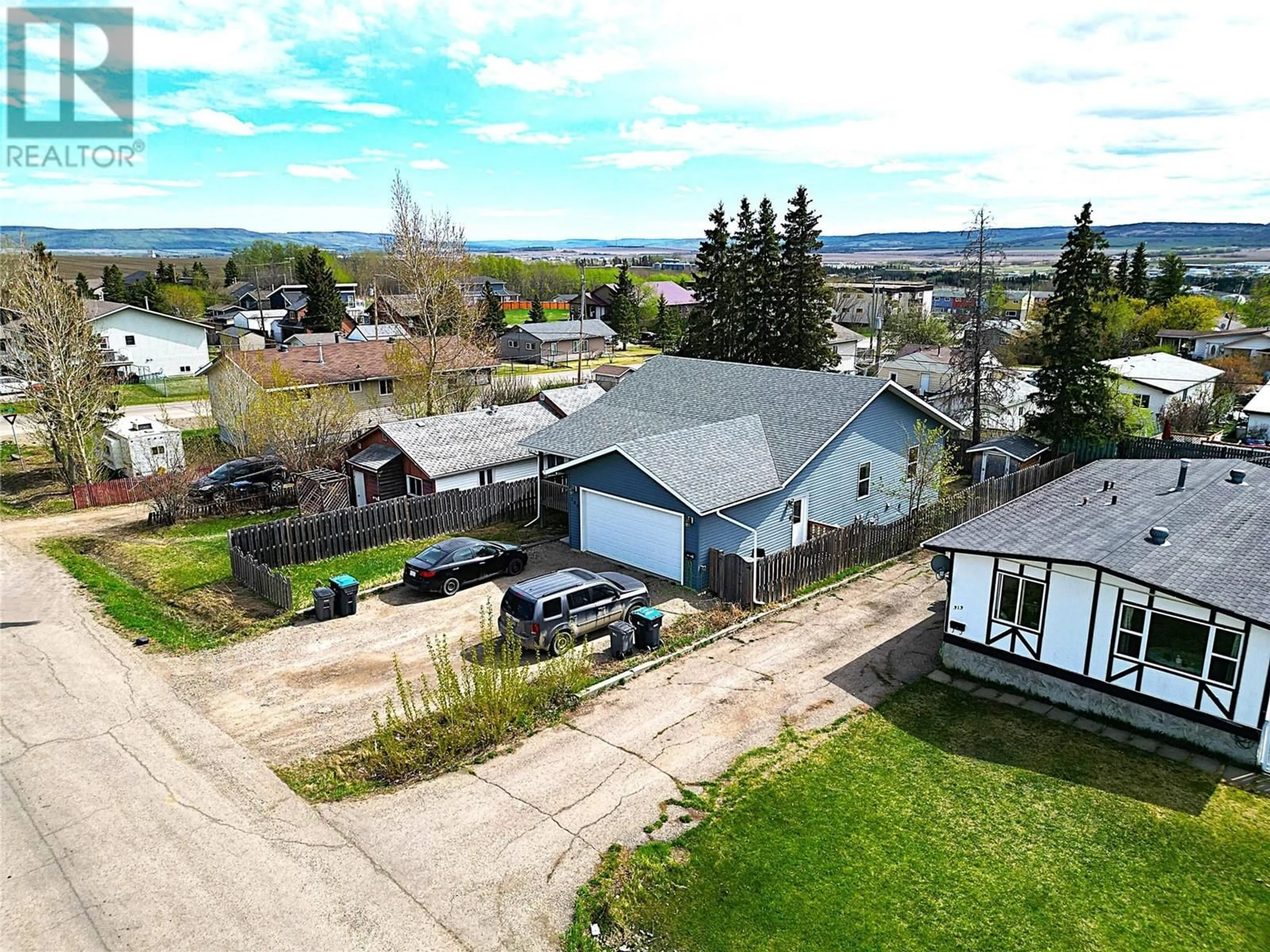 A pic from outside/outdoor area/front of a property/back of a property/a pic from drone, street for 309 99 AVENUE, Dawson Creek British Columbia V1G1T1