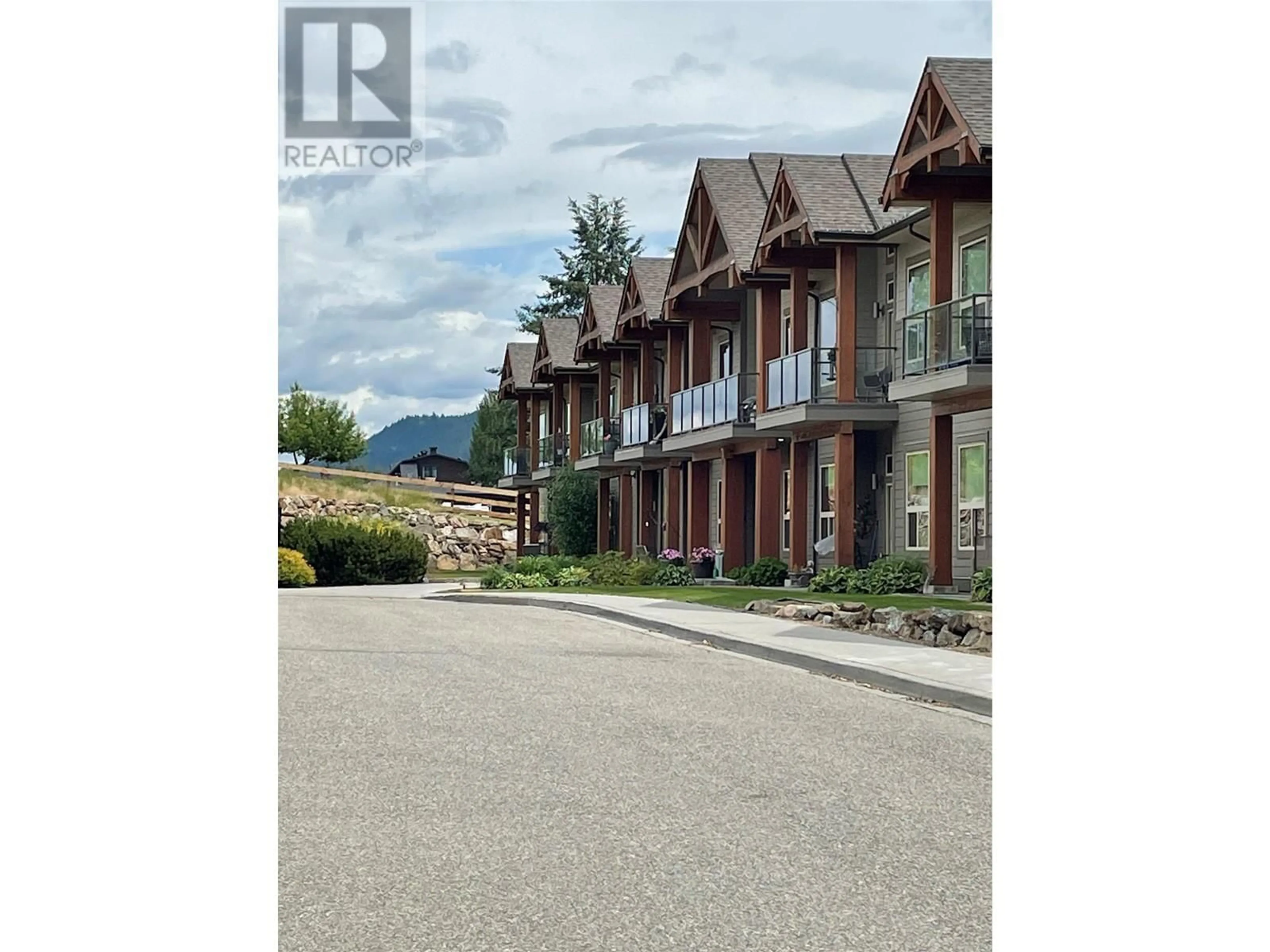 A pic from outside/outdoor area/front of a property/back of a property/a pic from drone, street for 212 - 9100 MACKIE DRIVE, Coldstream British Columbia V1B1G9