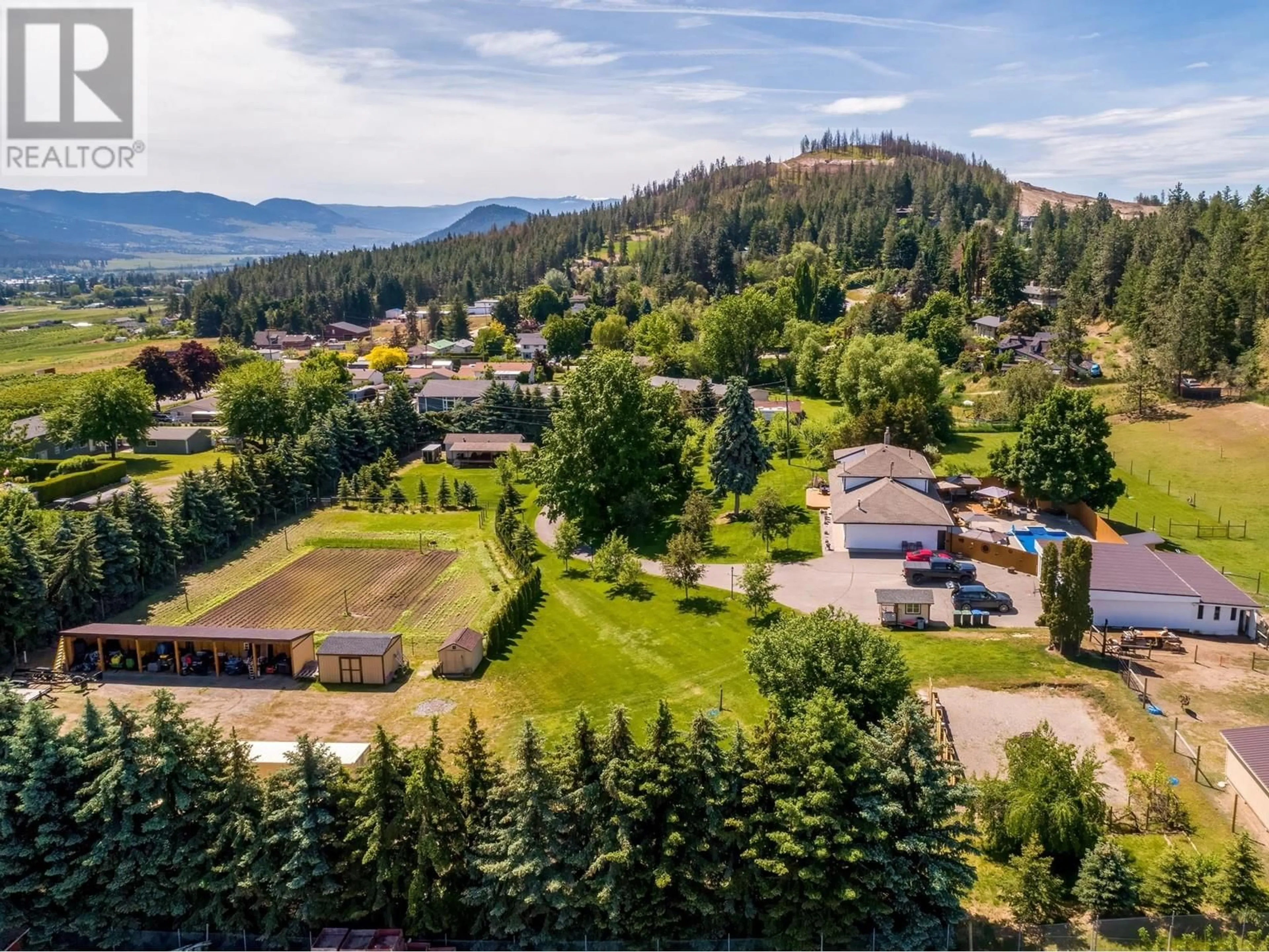A pic from outside/outdoor area/front of a property/back of a property/a pic from drone, mountain view for 2132 MONTE CARLO ROAD, Lake Country British Columbia V4V1K6