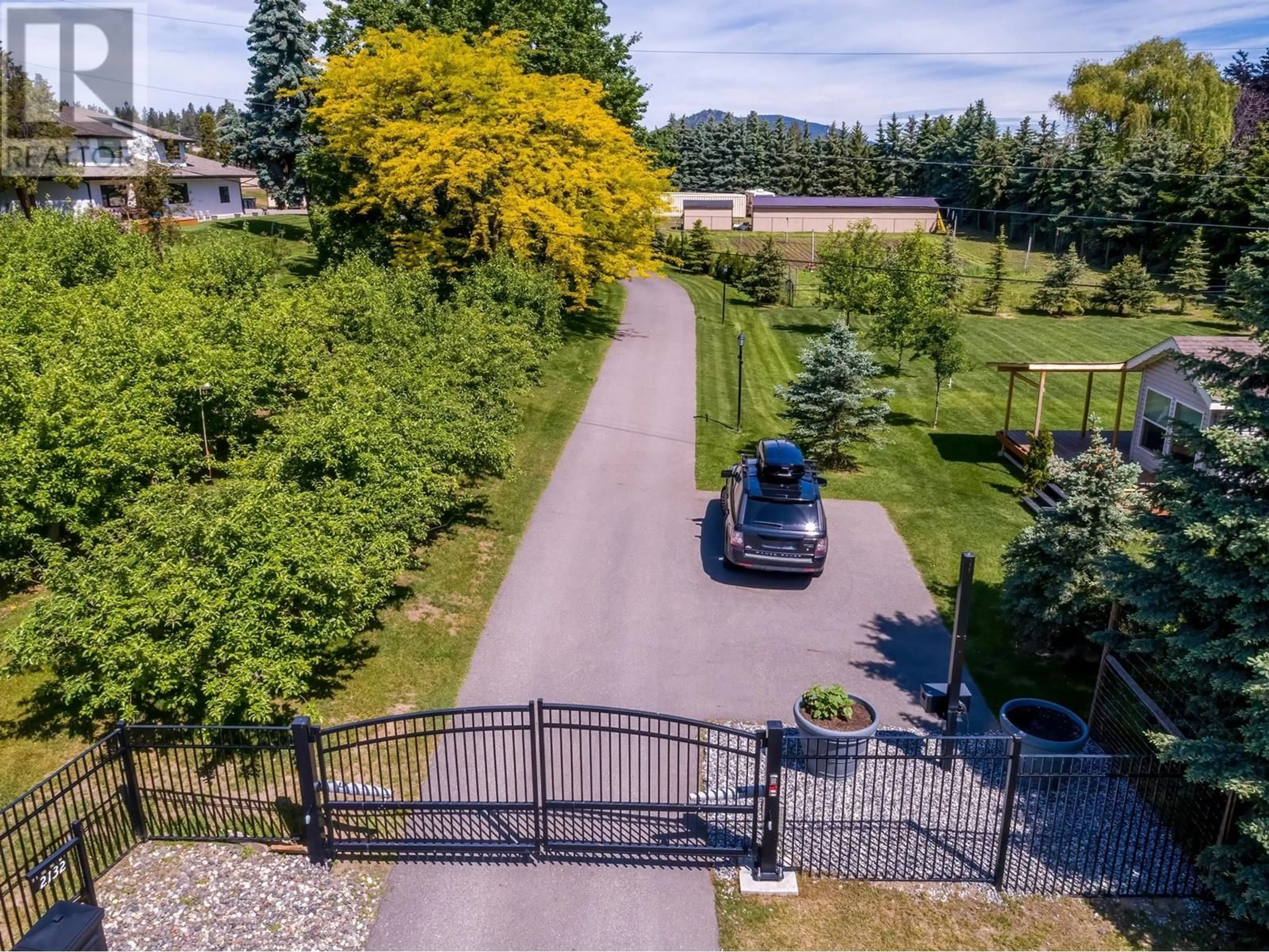 A pic from outside/outdoor area/front of a property/back of a property/a pic from drone, street for 2132 MONTE CARLO ROAD, Lake Country British Columbia V4V1K6