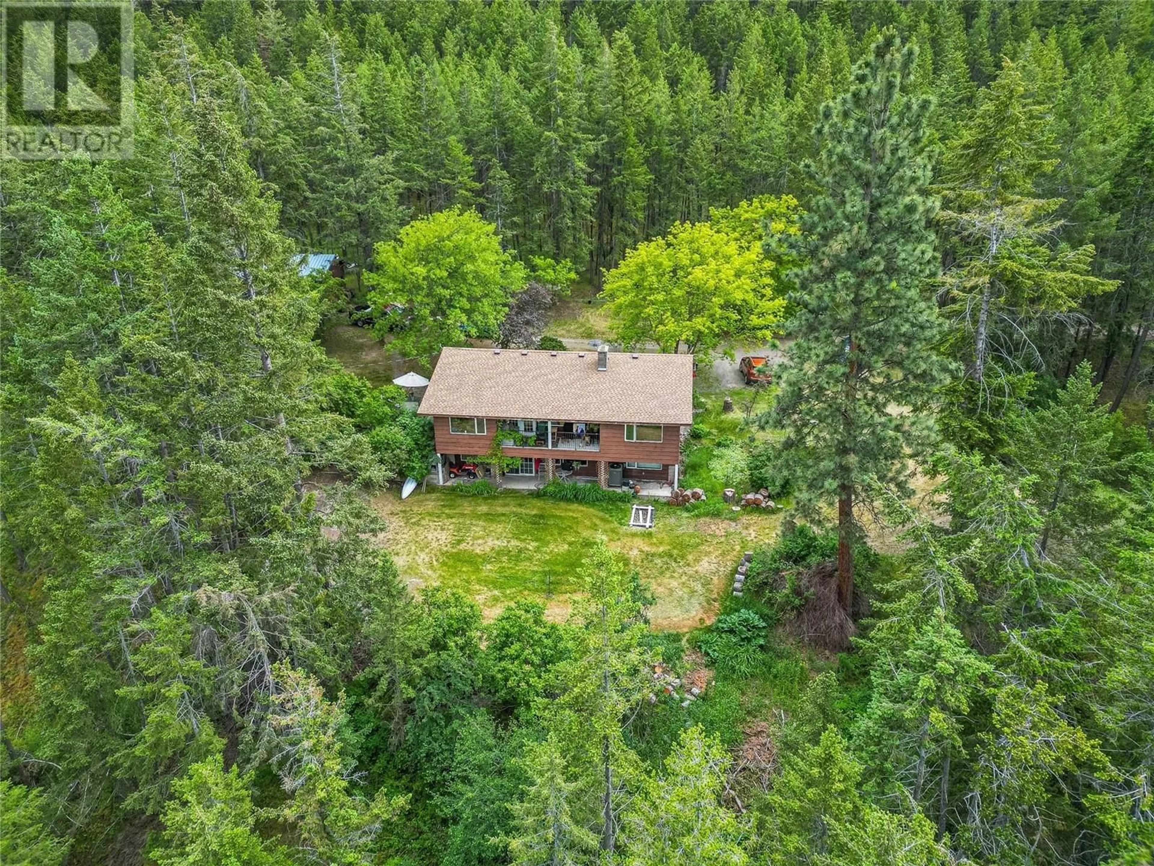 A pic from outside/outdoor area/front of a property/back of a property/a pic from drone, forest/trees view for 5460 BACK ROAD, Westwold British Columbia V0E3B1