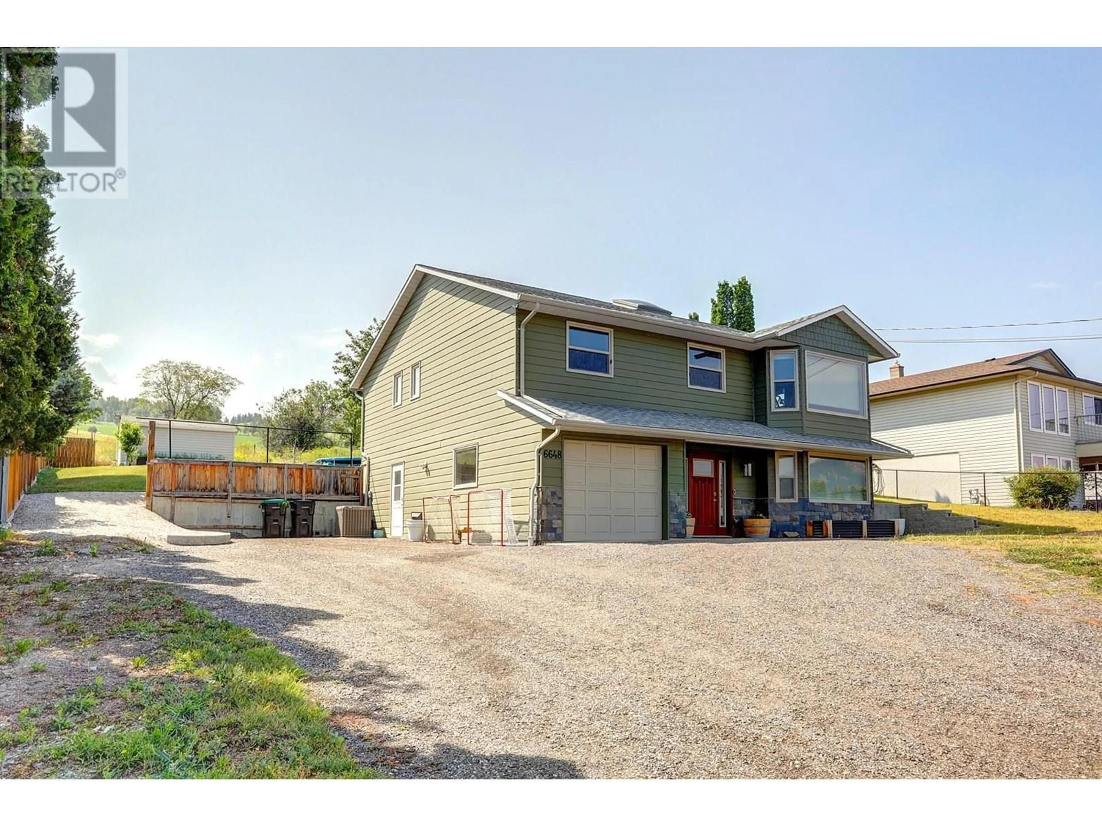 A pic from outside/outdoor area/front of a property/back of a property/a pic from drone, street for 6648 APOLLO ROAD, Vernon British Columbia V1H1J2