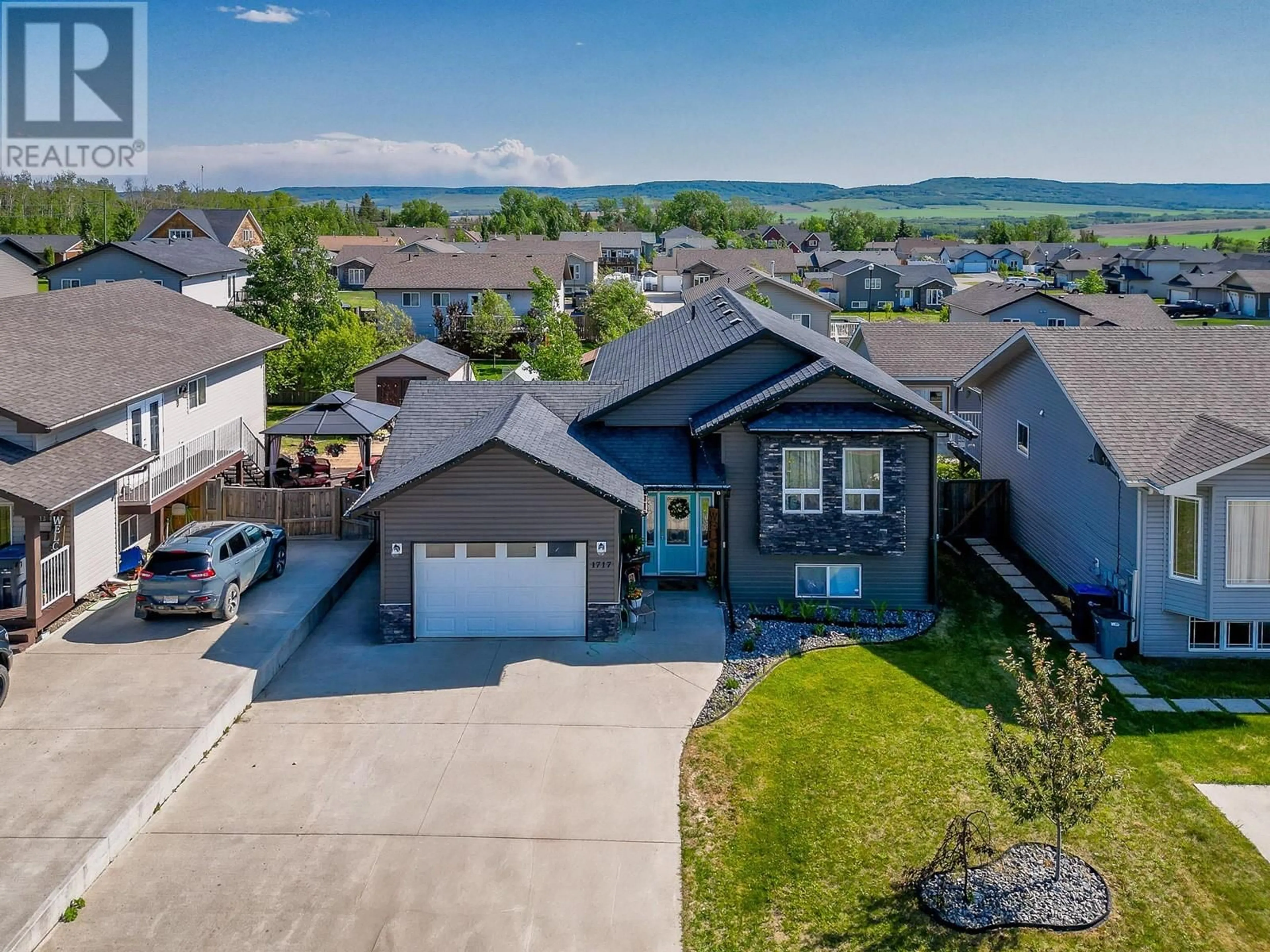 A pic from outside/outdoor area/front of a property/back of a property/a pic from drone, water/lake/river/ocean view for 1717 86 AVENUE, Dawson Creek British Columbia V1G0B2