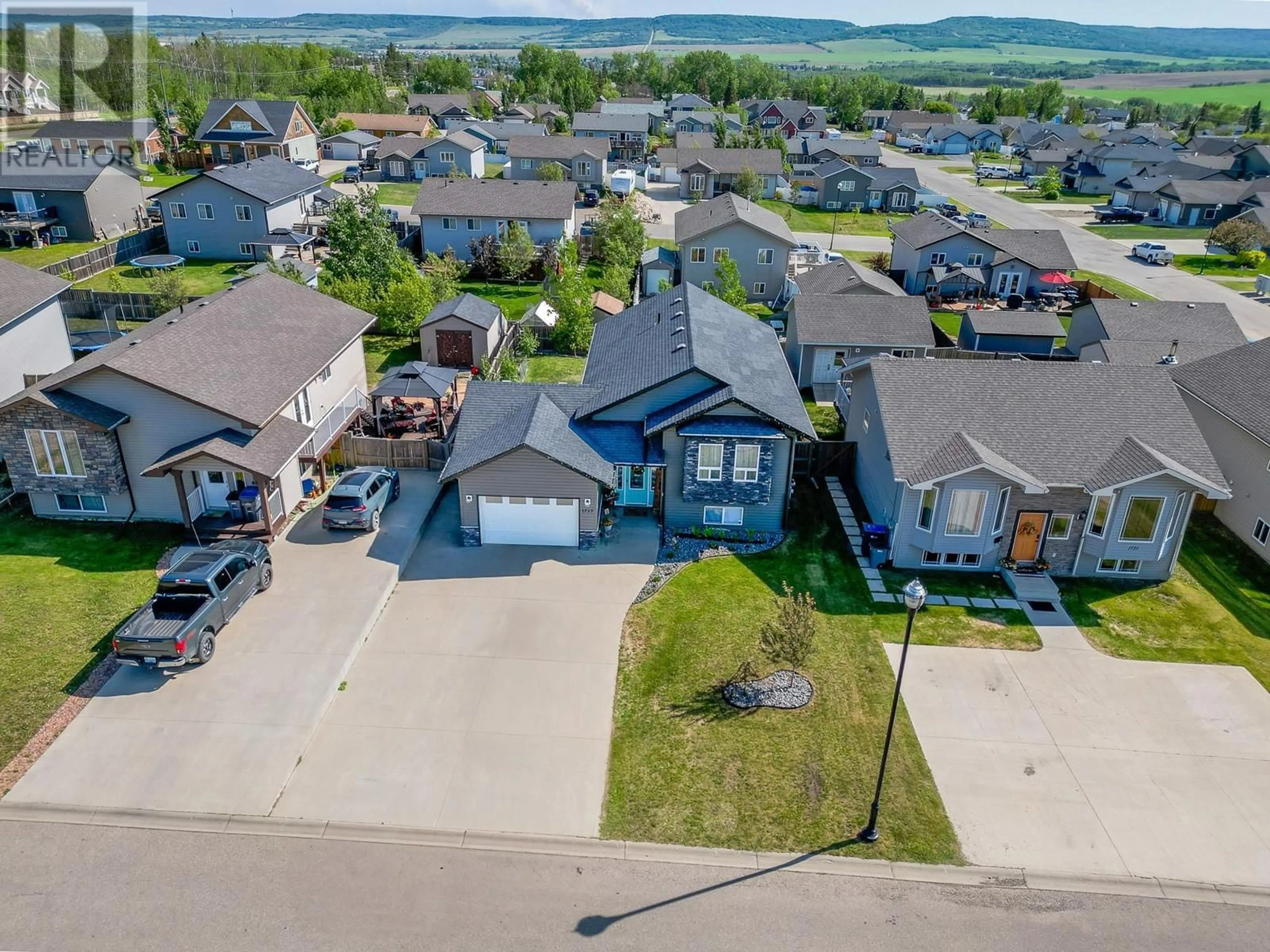 A pic from outside/outdoor area/front of a property/back of a property/a pic from drone, street for 1717 86 AVENUE, Dawson Creek British Columbia V1G0B2