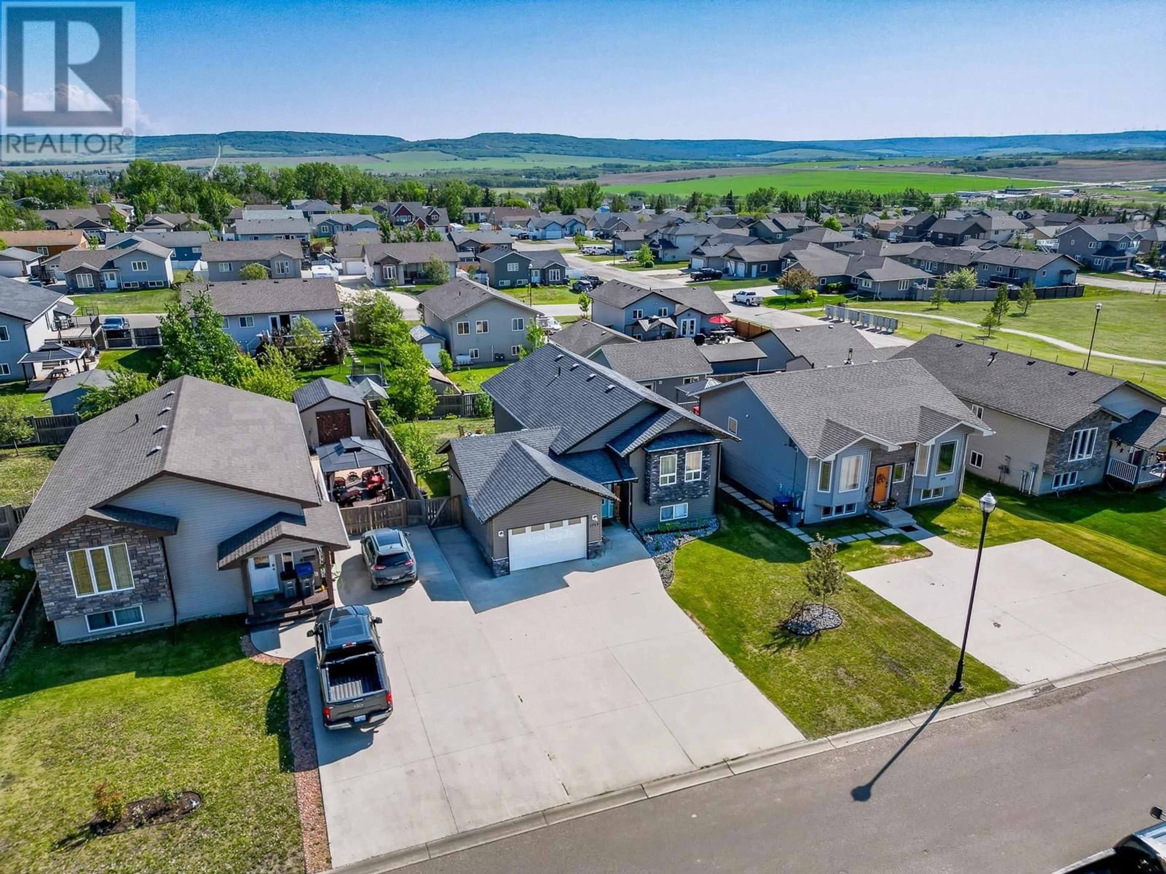 A pic from outside/outdoor area/front of a property/back of a property/a pic from drone, mountain view for 1717 86 AVENUE, Dawson Creek British Columbia V1G0B2
