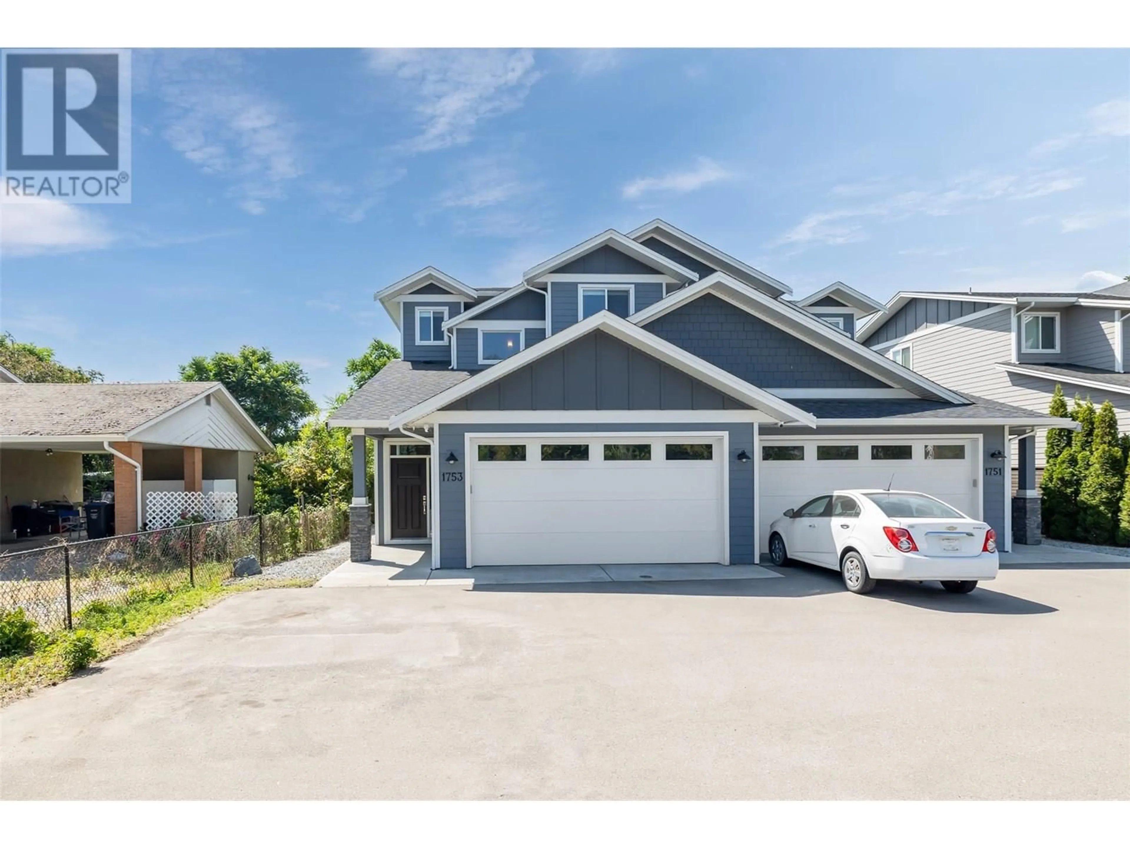 Home with vinyl exterior material, street for 1753 KLO ROAD, Kelowna British Columbia V1W3P3