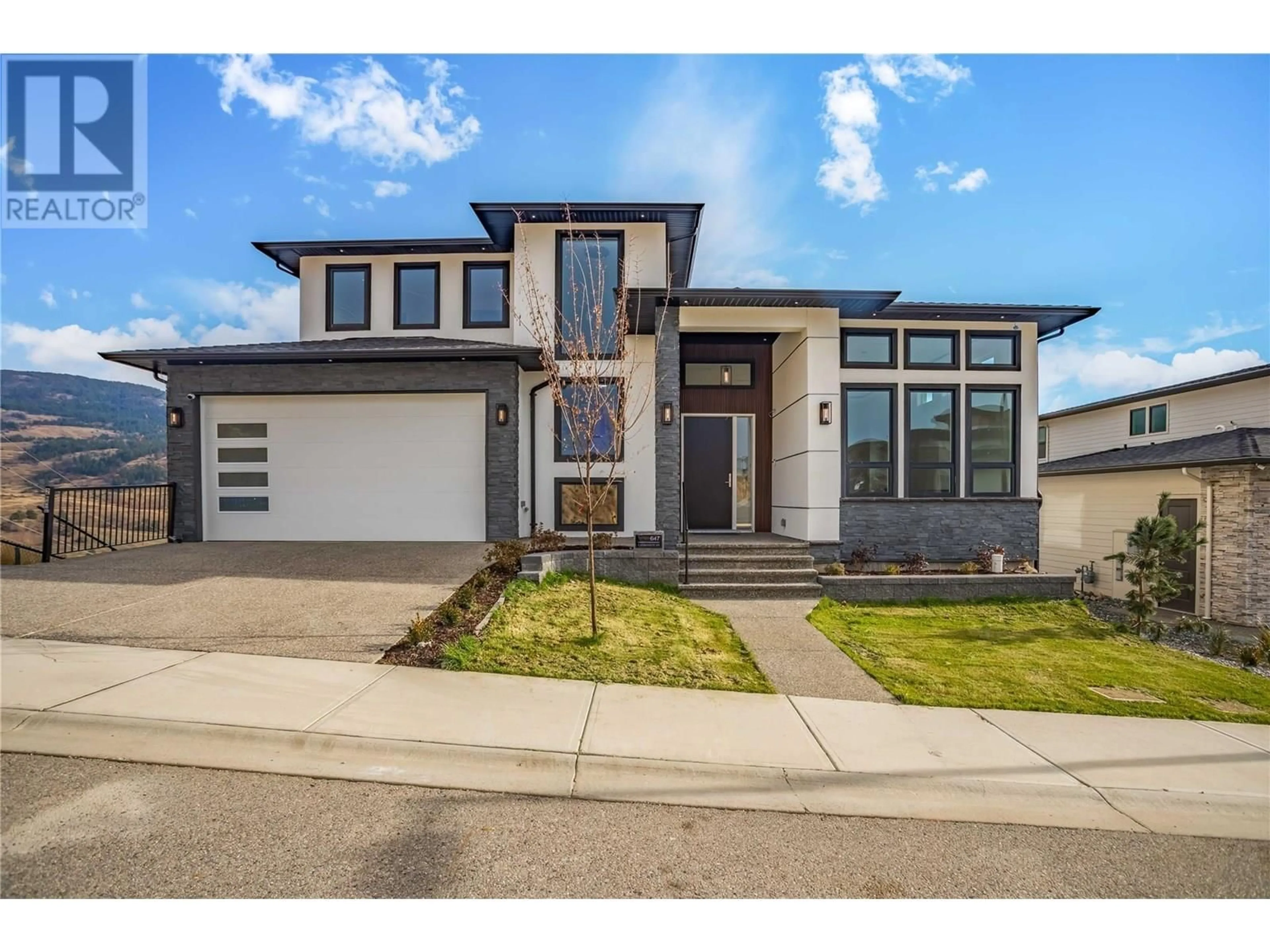 Home with brick exterior material, street for 647 CARNOUSTIE DRIVE, Kelowna British Columbia V1P1V2