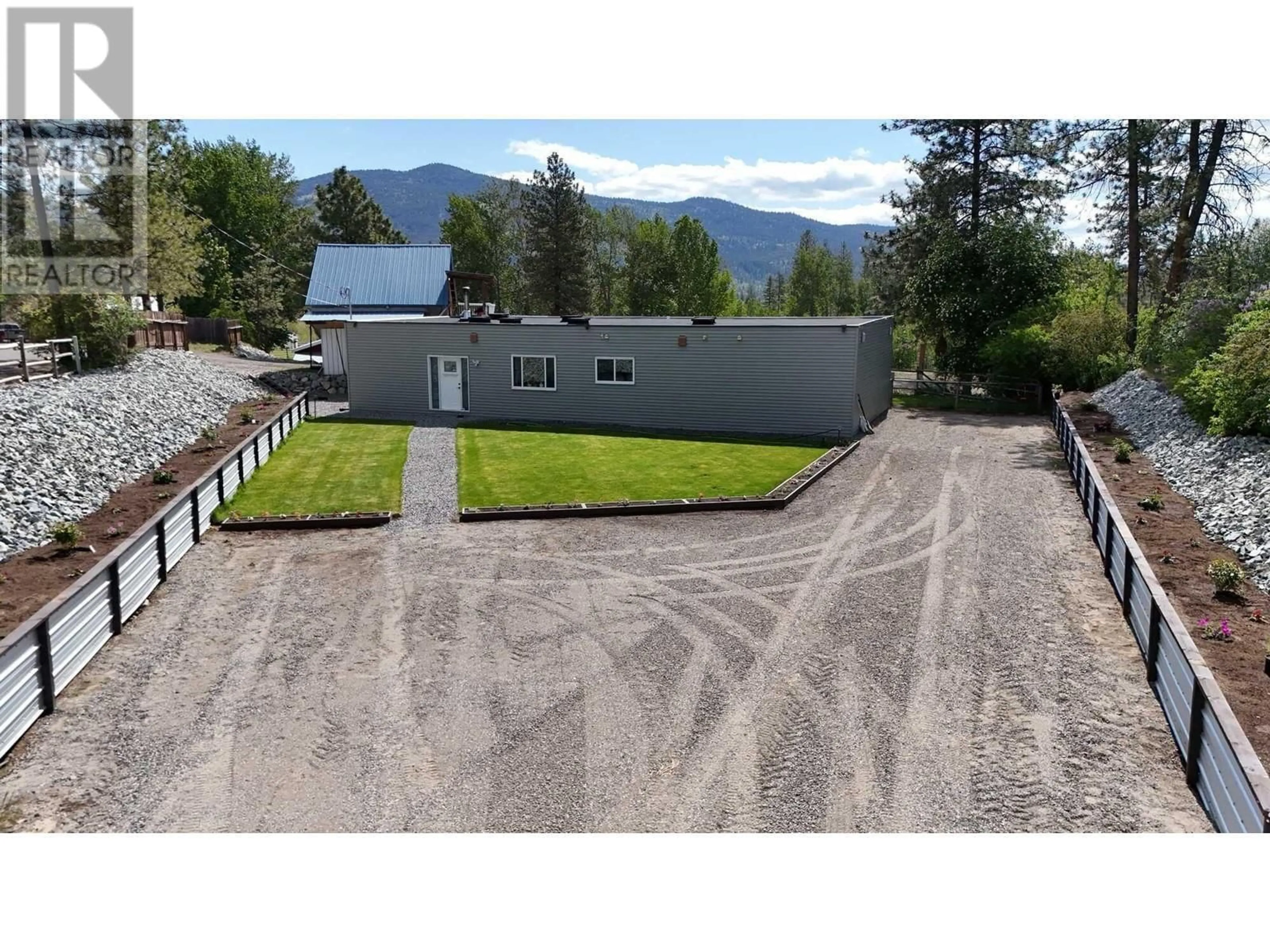 A pic from outside/outdoor area/front of a property/back of a property/a pic from drone, mountain view for 310 GUICHON AVENUE, Merritt British Columbia V0K1Y0