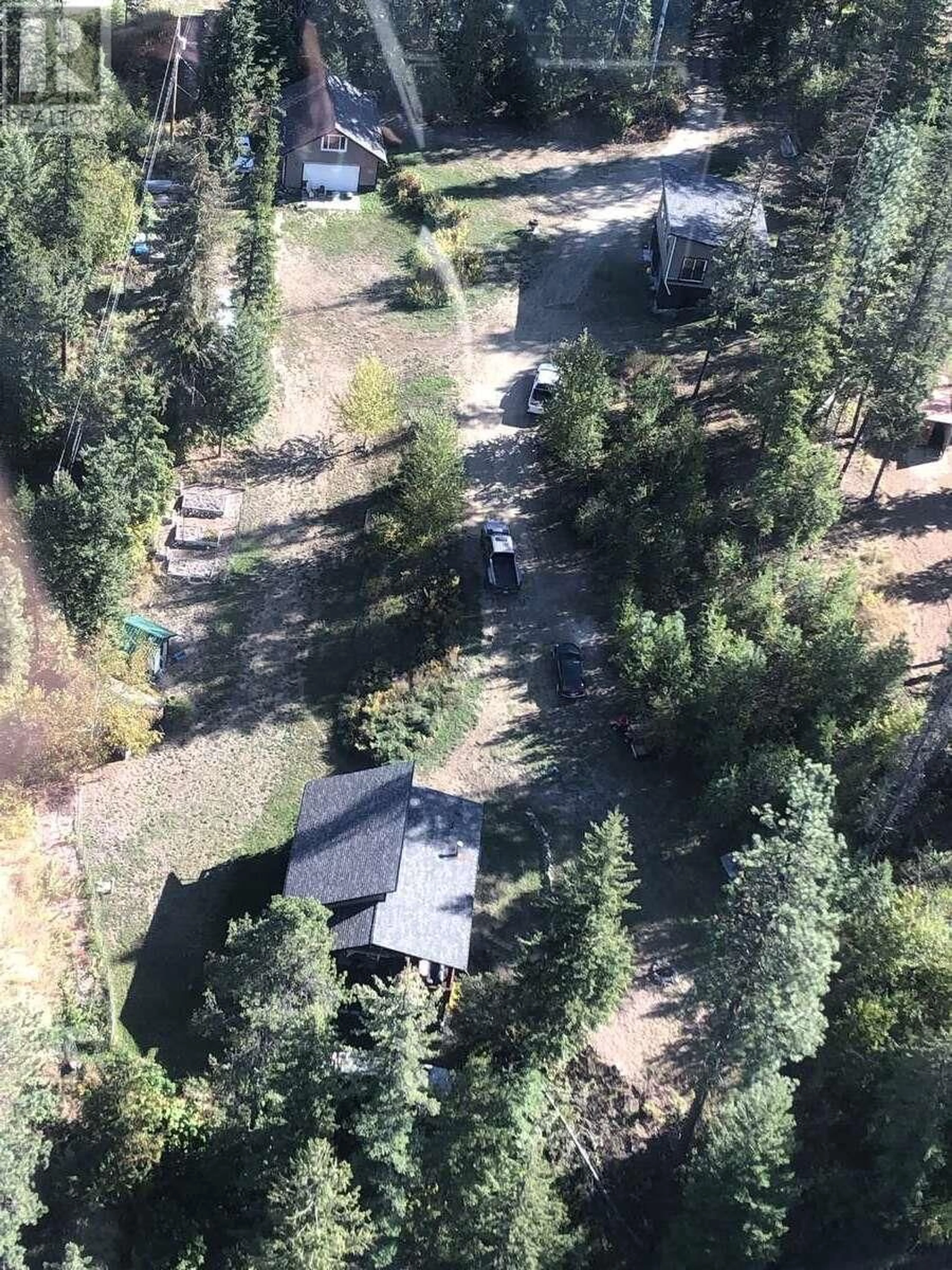 A pic from outside/outdoor area/front of a property/back of a property/a pic from drone, forest/trees view for 4602 CARLSON ROAD, Nelson British Columbia V1L6X3