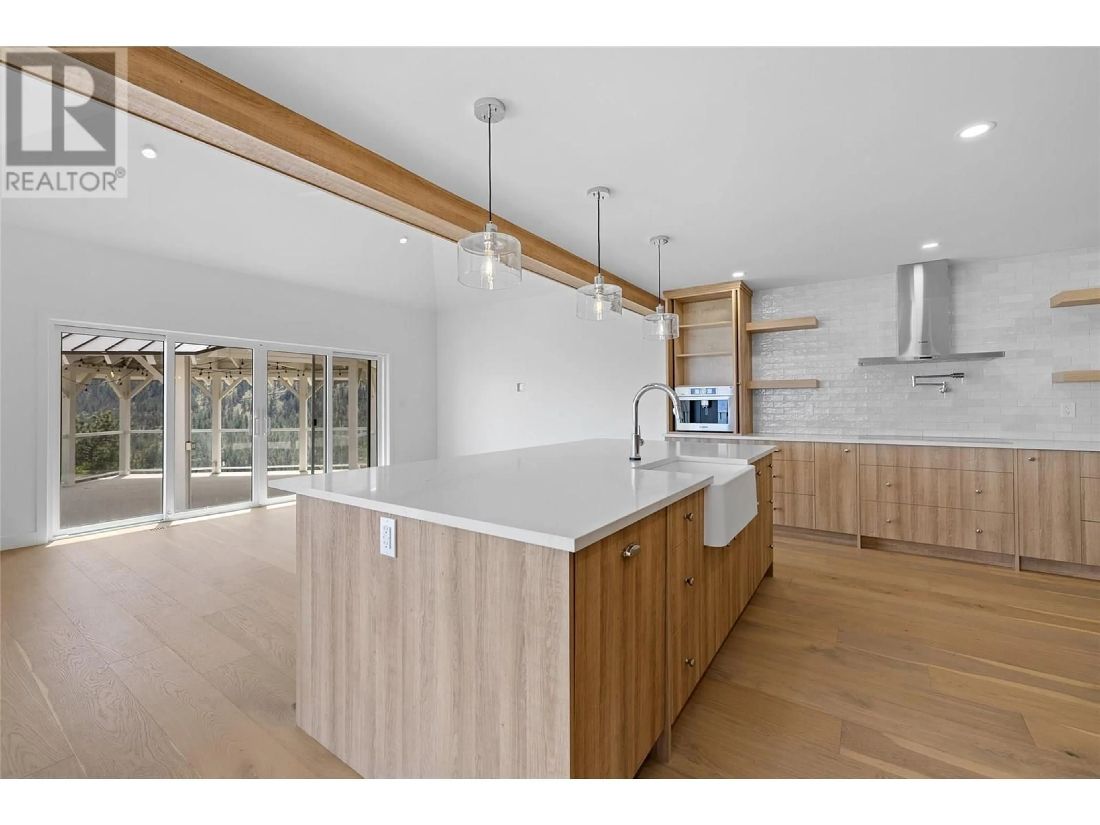 Open concept kitchen, wood/laminate floor for 2632 FORSYTH DRIVE, Penticton British Columbia V2A8Y9