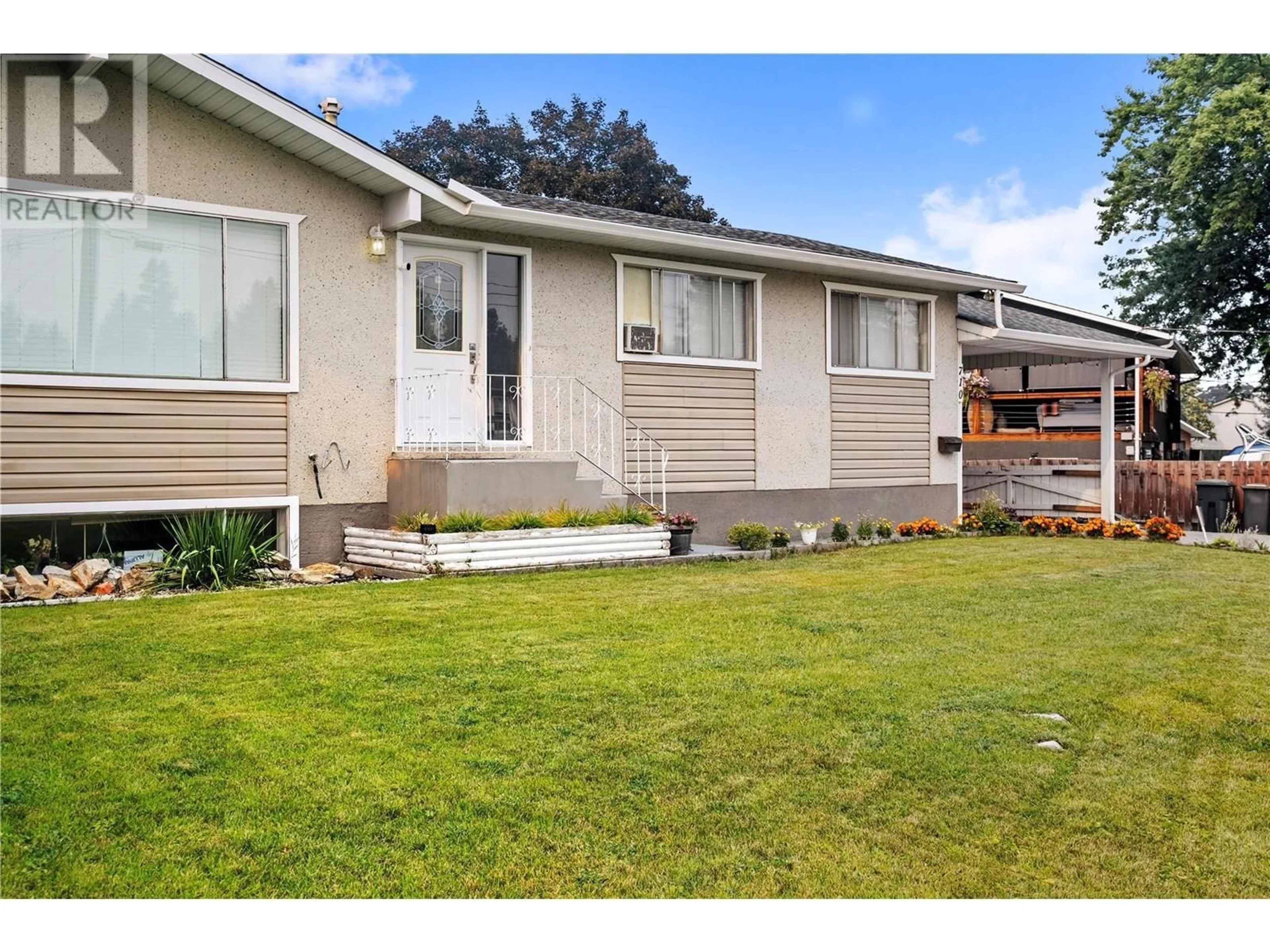 Home with vinyl exterior material, street for 710 BELL ROAD, Rutland British Columbia V1X2Y1