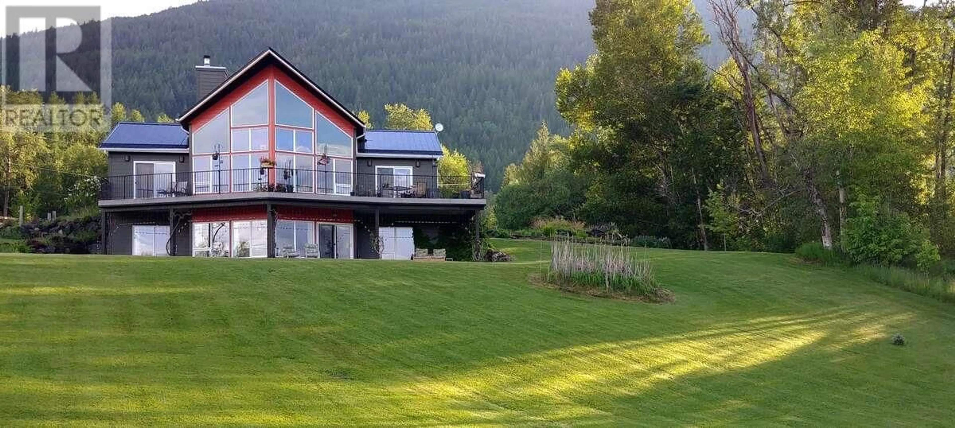 A pic from outside/outdoor area/front of a property/back of a property/a pic from drone, mountain view for 1067 SIMMONS ROAD, Creston British Columbia V0B1G7