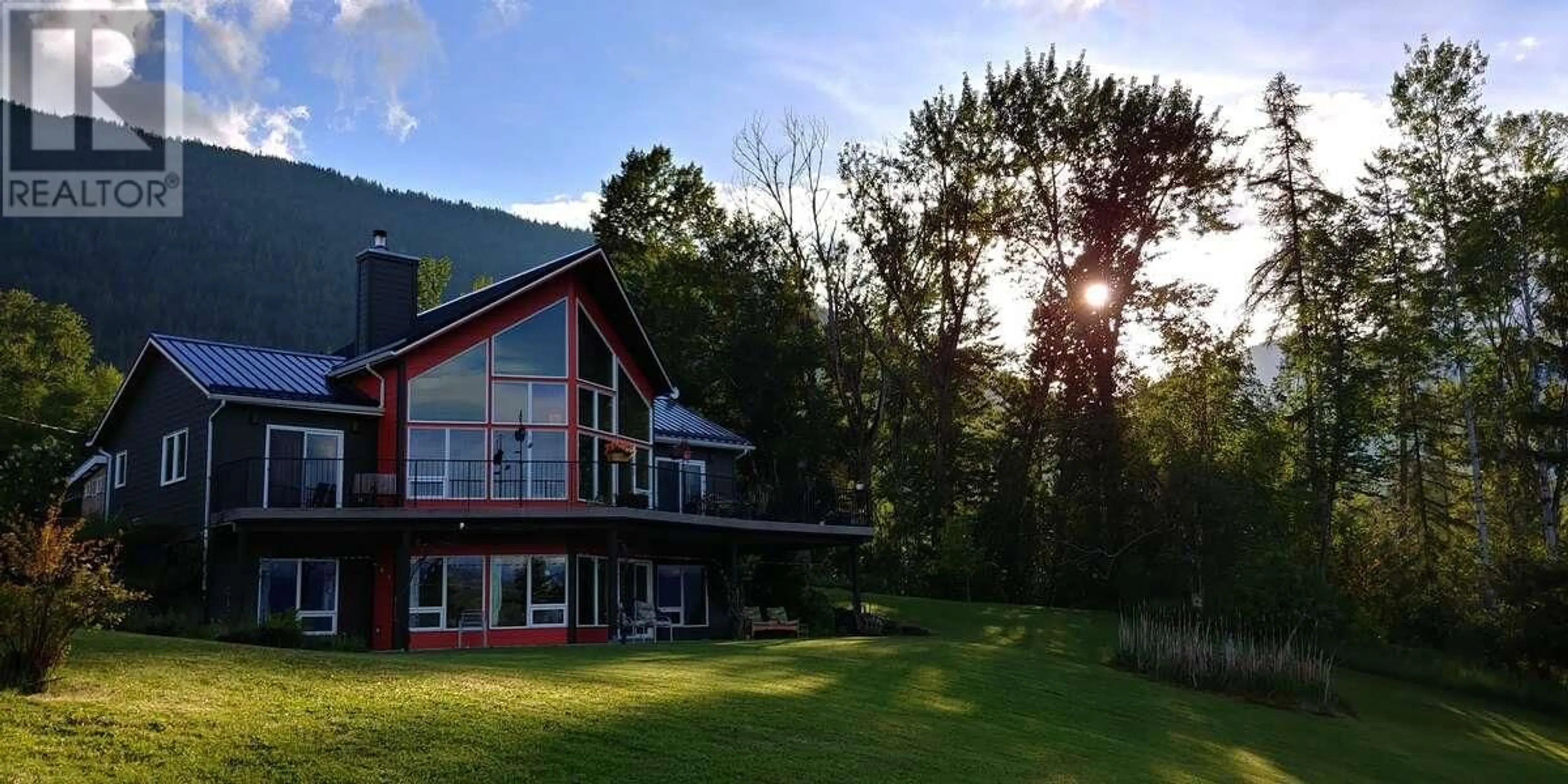 A pic from outside/outdoor area/front of a property/back of a property/a pic from drone, water/lake/river/ocean view for 1067 SIMMONS ROAD, Creston British Columbia V0B1G7