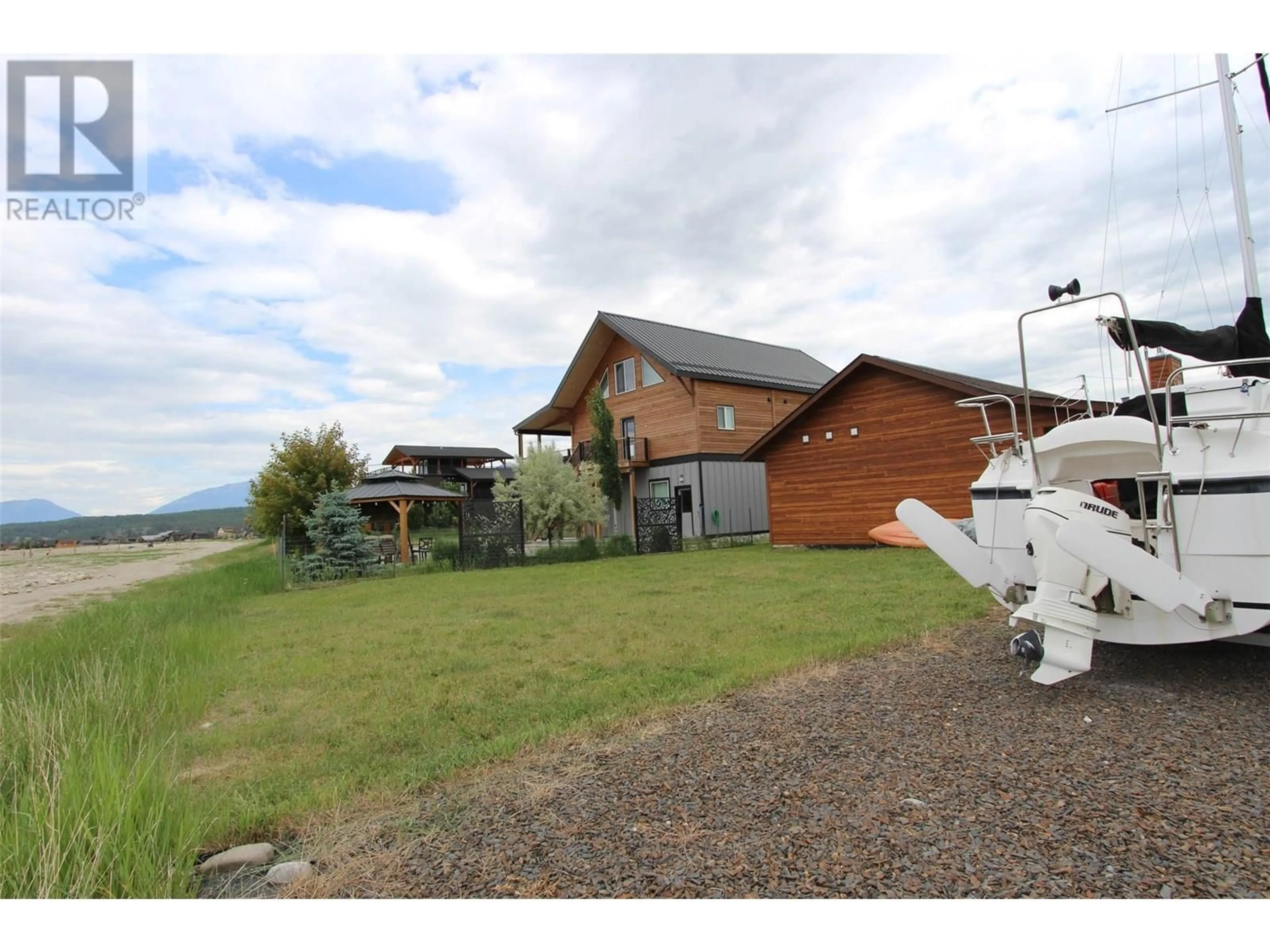 A pic from outside/outdoor area/front of a property/back of a property/a pic from drone, water/lake/river/ocean view for 1695 KOOCANUSA LAKE DRIVE, Newgate British Columbia V0B1T5