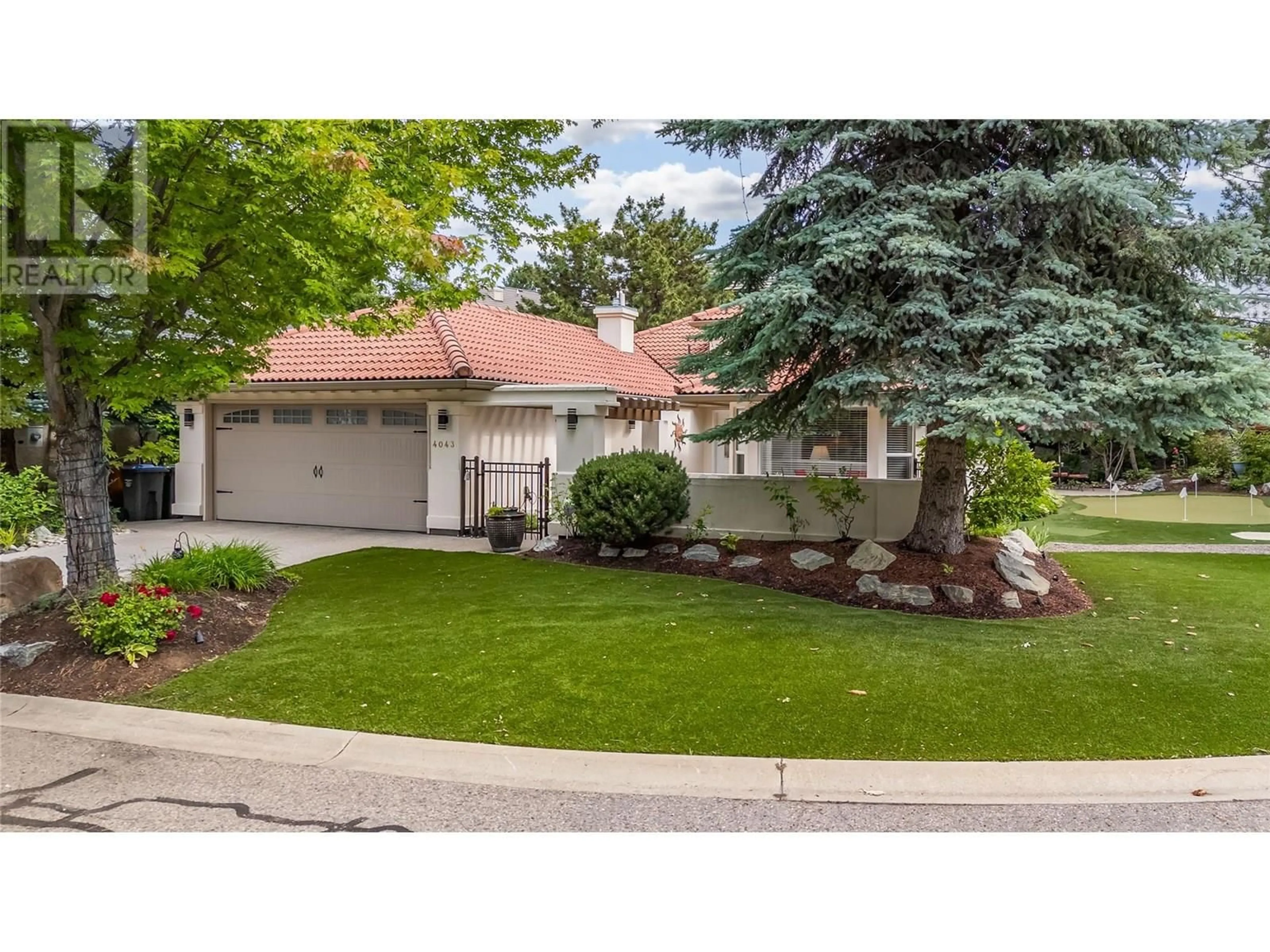 Home with vinyl exterior material, street for 4043 GALLAGHERS TERRACE, Kelowna British Columbia V1W3Z8