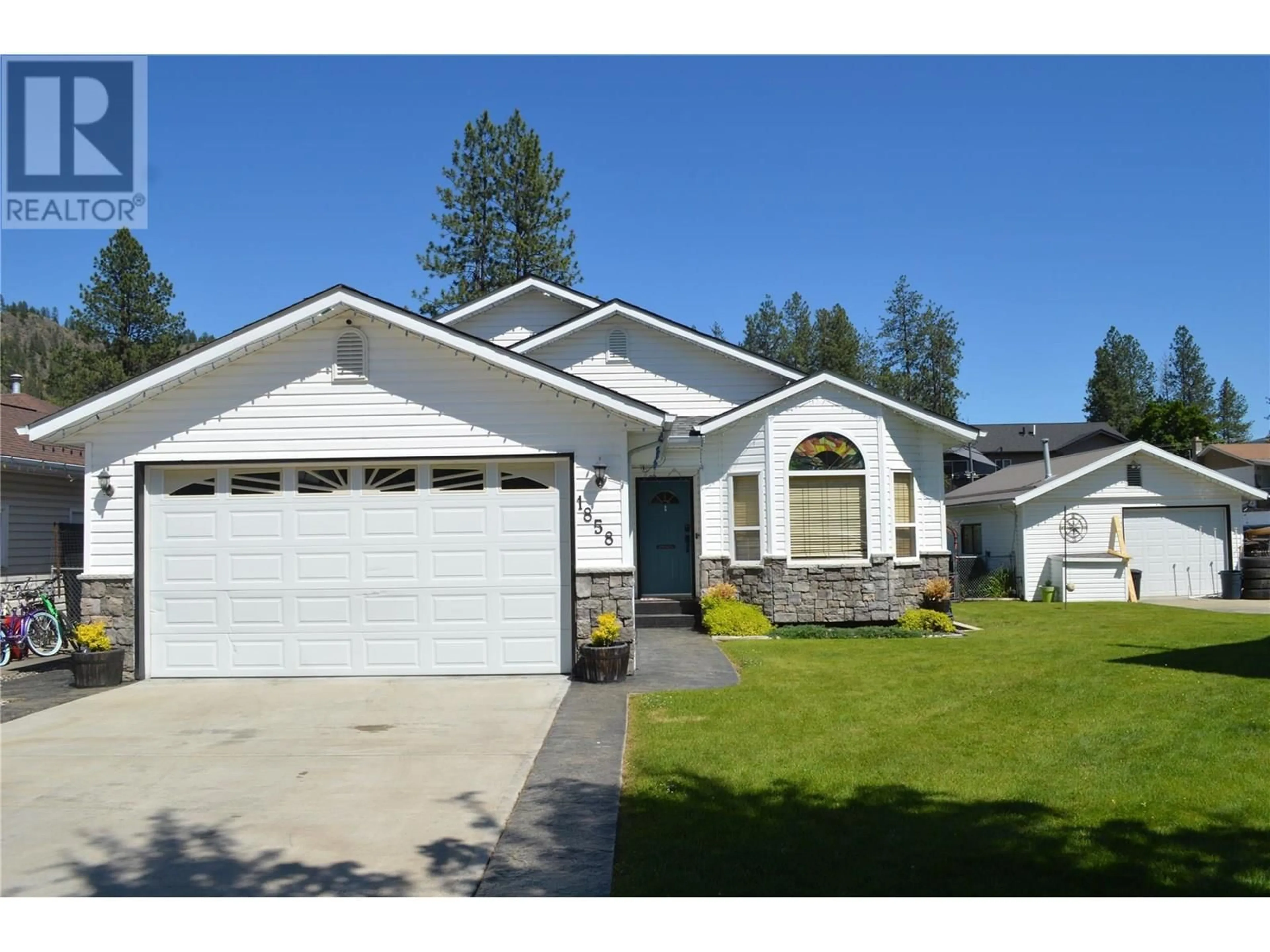 Home with vinyl exterior material, street for 1858 WESTERN WAY, Grand Forks British Columbia V0H1H2