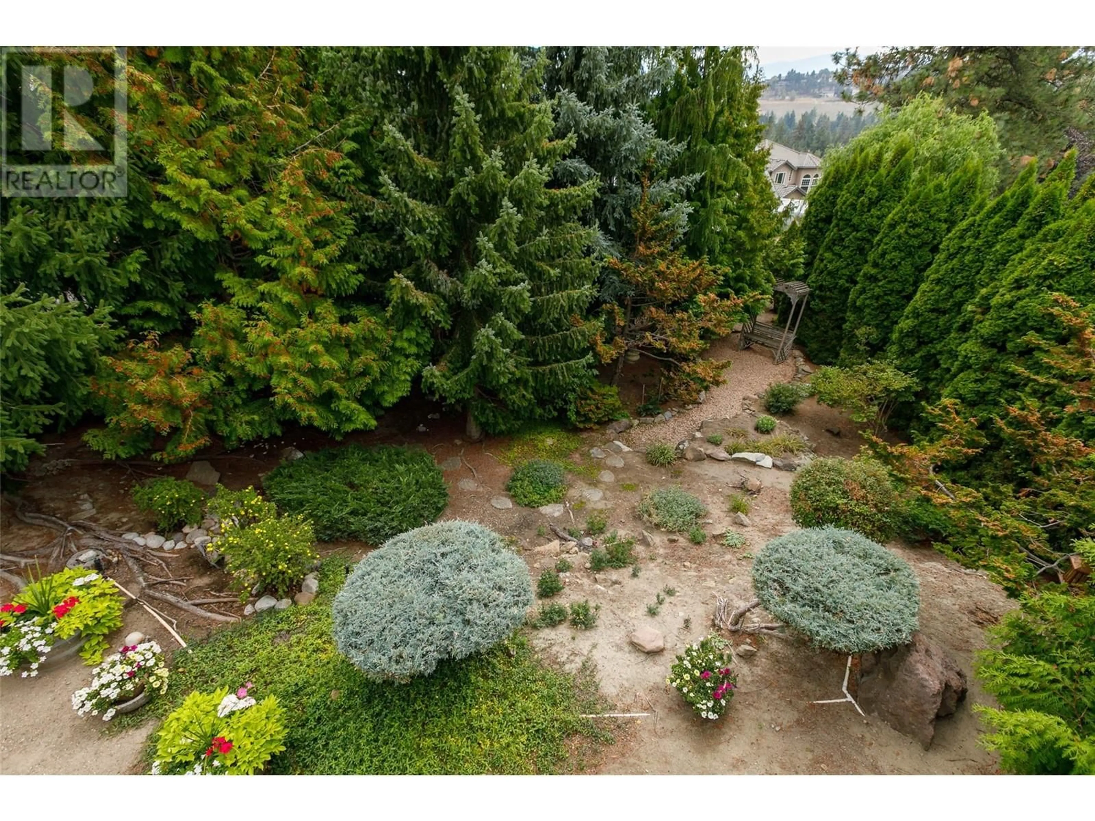 A pic from outside/outdoor area/front of a property/back of a property/a pic from drone, forest/trees view for 1043 CALEDONIA WAY, West Kelowna British Columbia V1Z3N7