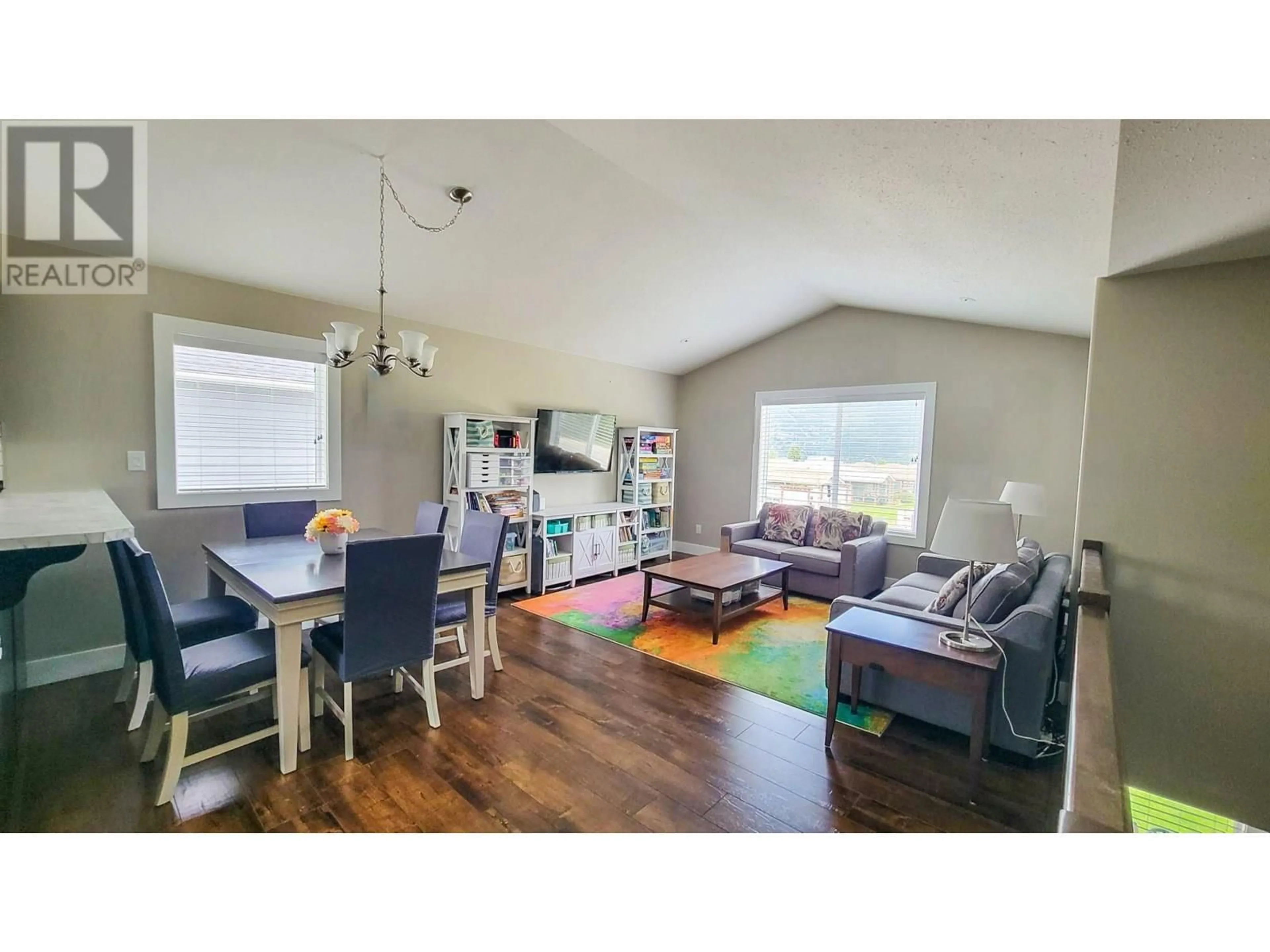 Living room with furniture, wood/laminate floor for 4208 16TH AVENUE, Castlegar British Columbia V1N4X7