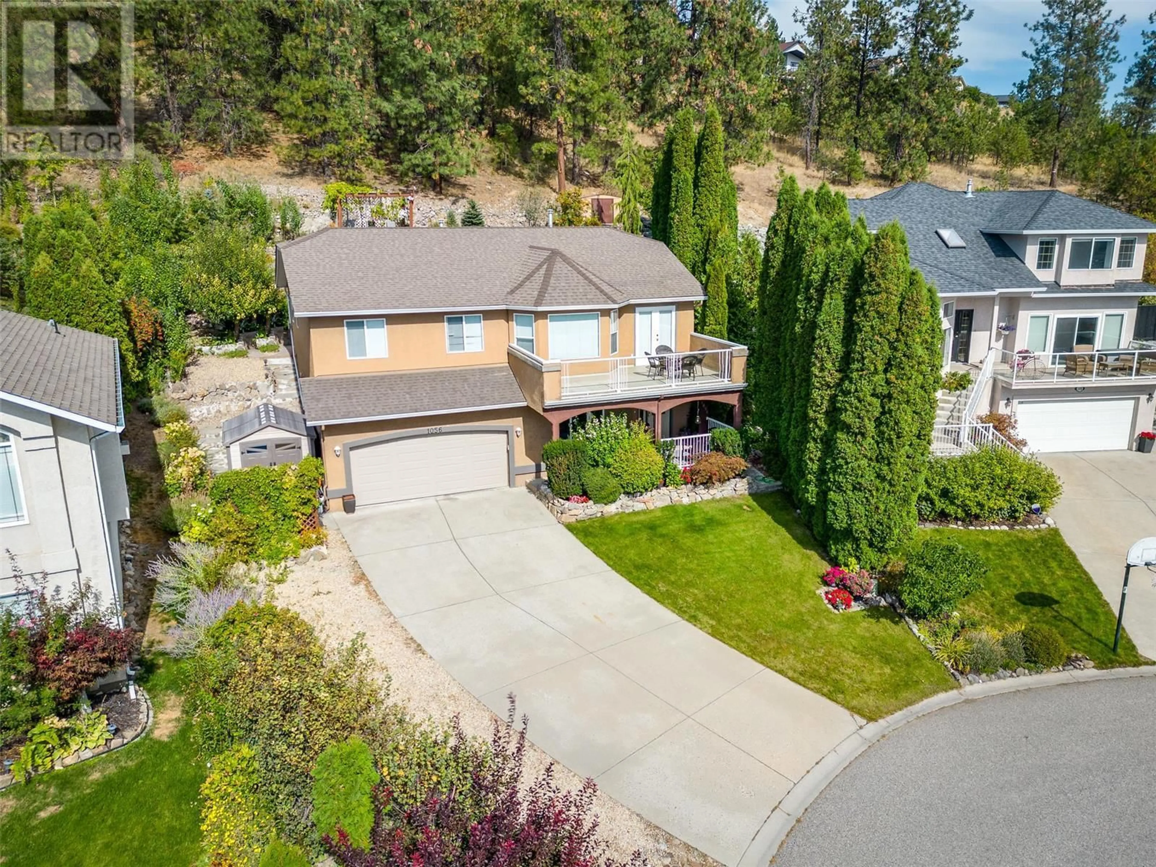 A pic from outside/outdoor area/front of a property/back of a property/a pic from drone, street for 1056 CALEDONIA WAY, West Kelowna British Columbia V1Z3N7