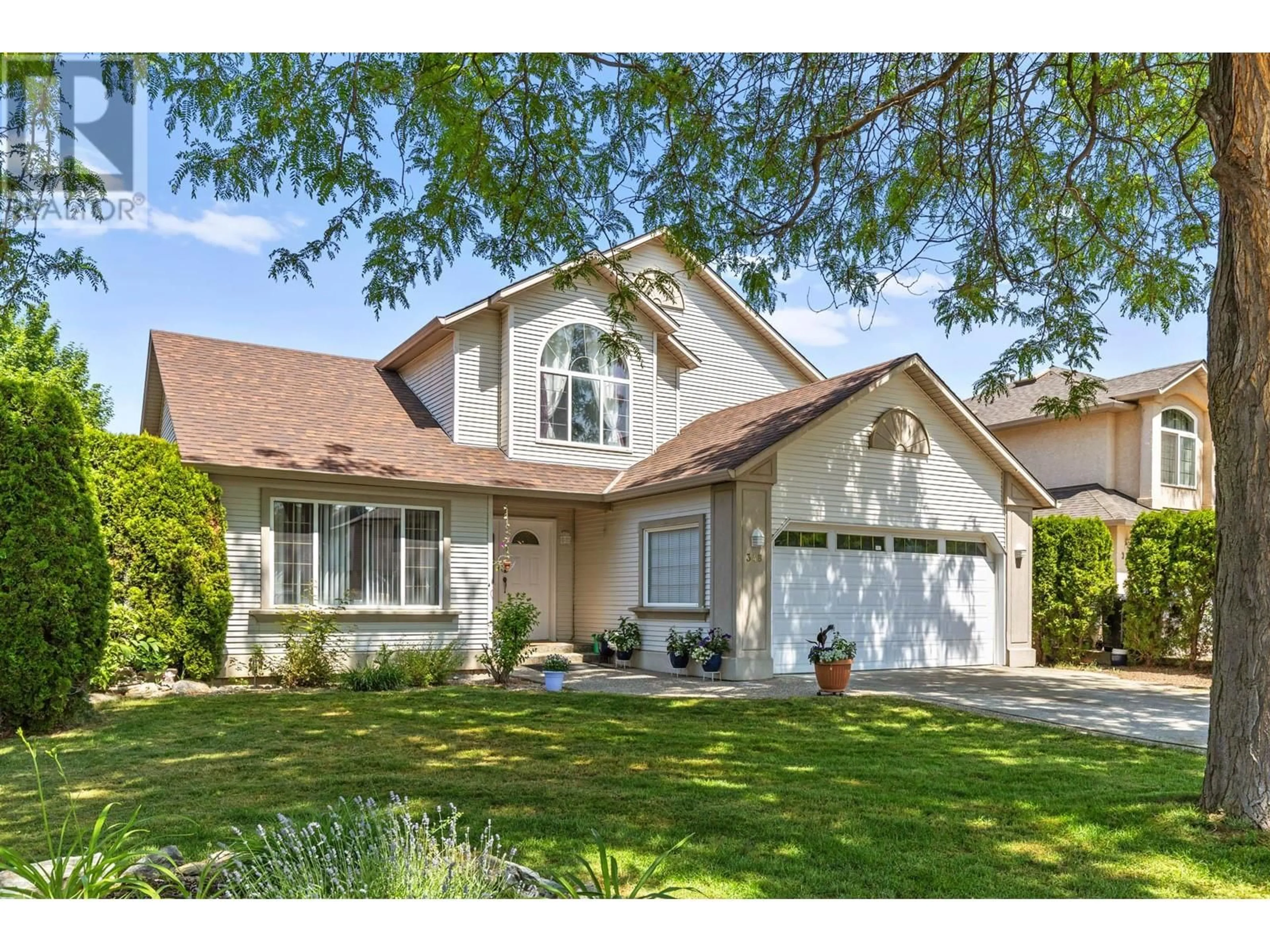 Home with vinyl exterior material, street for 348 WALLACE ROAD, Kelowna British Columbia V1X7M5