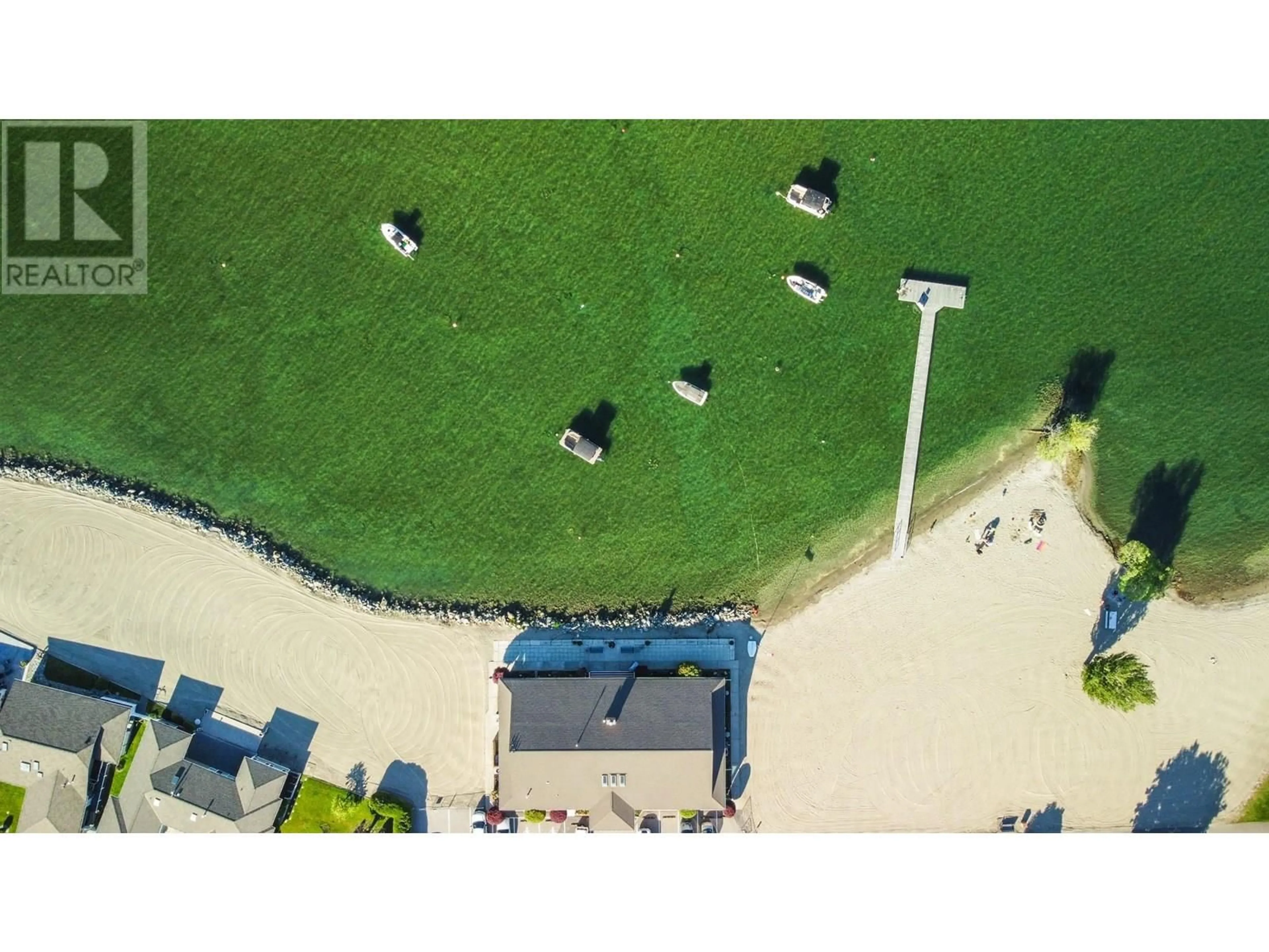 A pic from outside/outdoor area/front of a property/back of a property/a pic from drone, street for 606 RED WING DRIVE, Penticton British Columbia V2A8N7