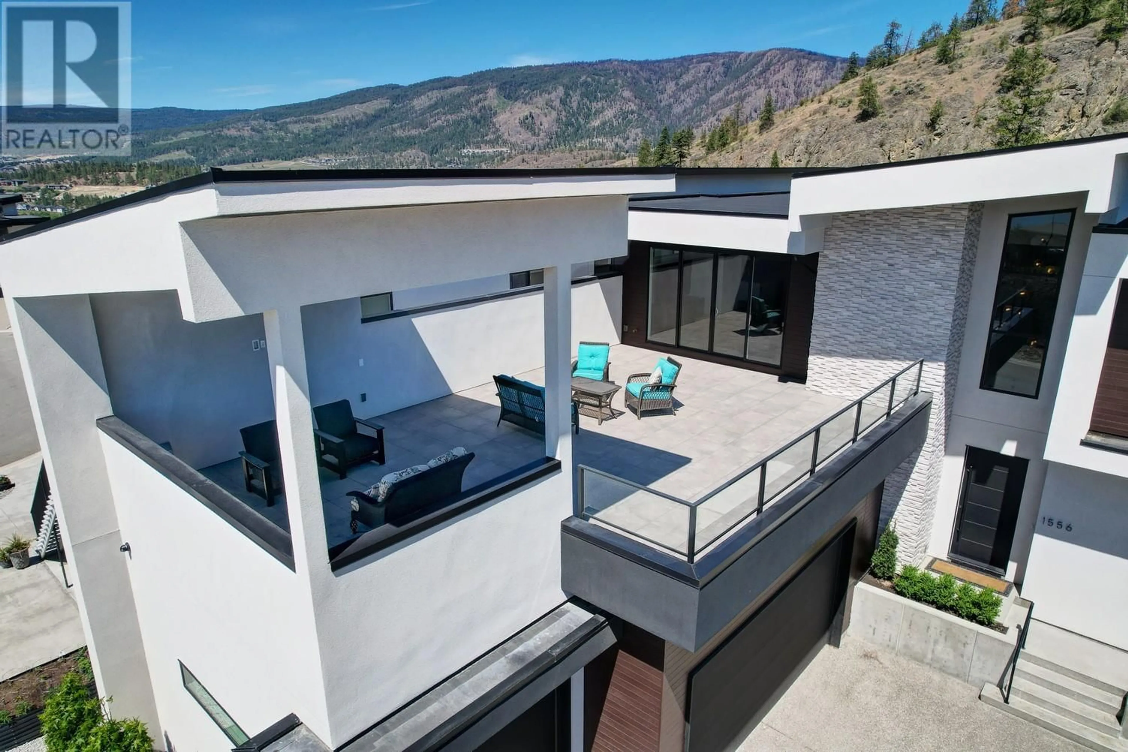 A pic from outside/outdoor area/front of a property/back of a property/a pic from drone, mountain view for 1556 CABERNET WAY, West Kelowna British Columbia V4T0E1