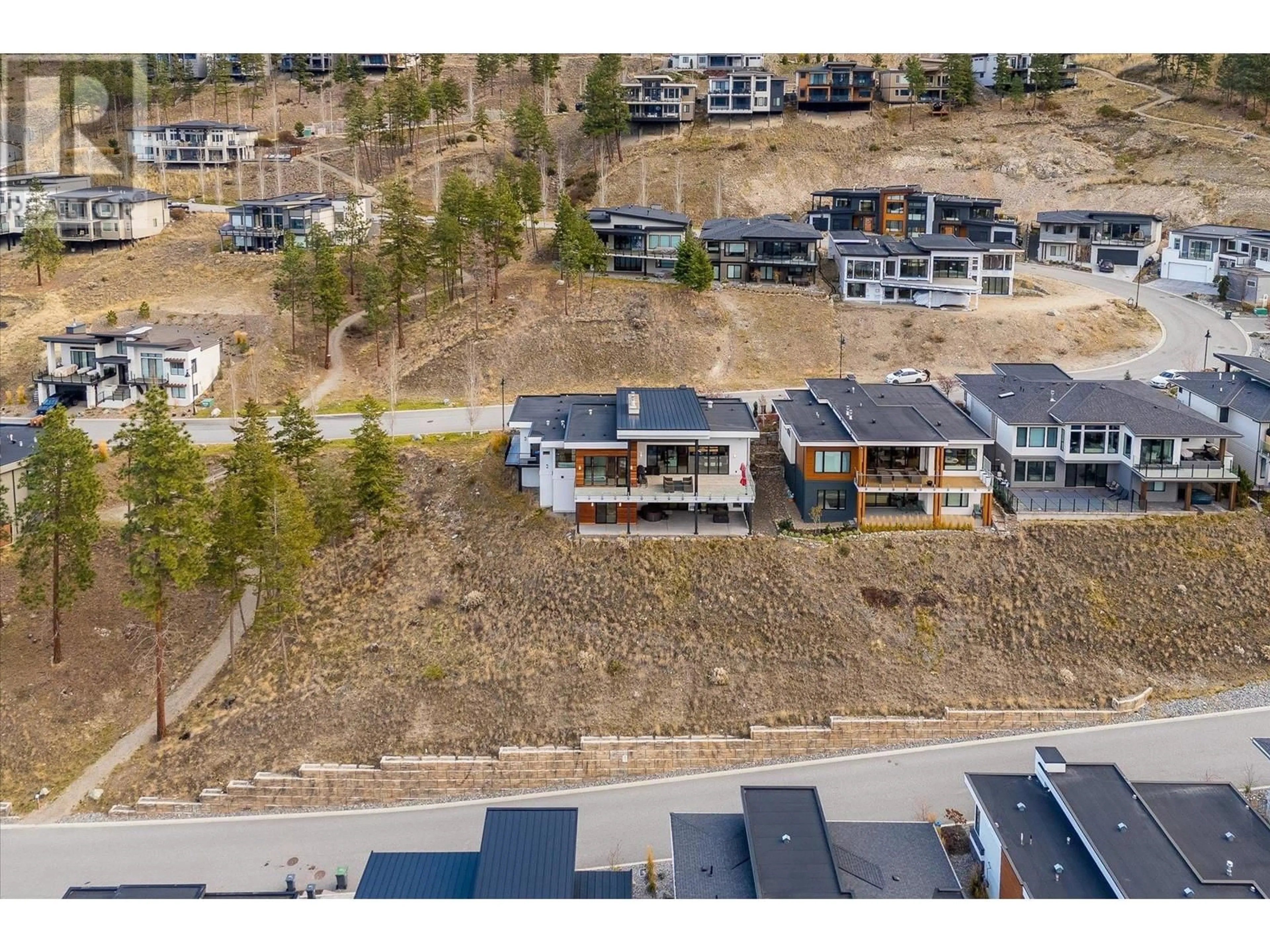 A pic from outside/outdoor area/front of a property/back of a property/a pic from drone, mountain view for 3380 WATER BIRCH CIRCLE, Kelowna British Columbia V1V3G1