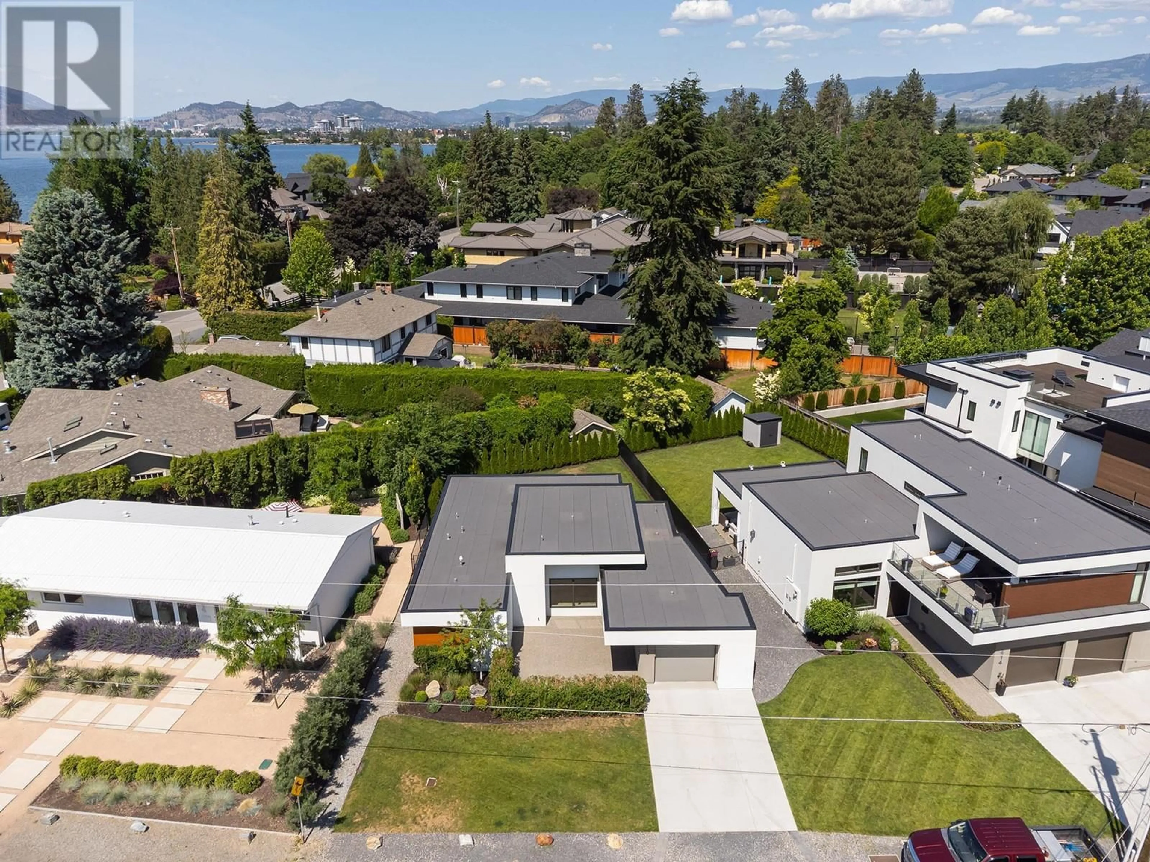 A pic from outside/outdoor area/front of a property/back of a property/a pic from drone, mountain view for 410 SARSONS ROAD, Kelowna British Columbia V1W1C2