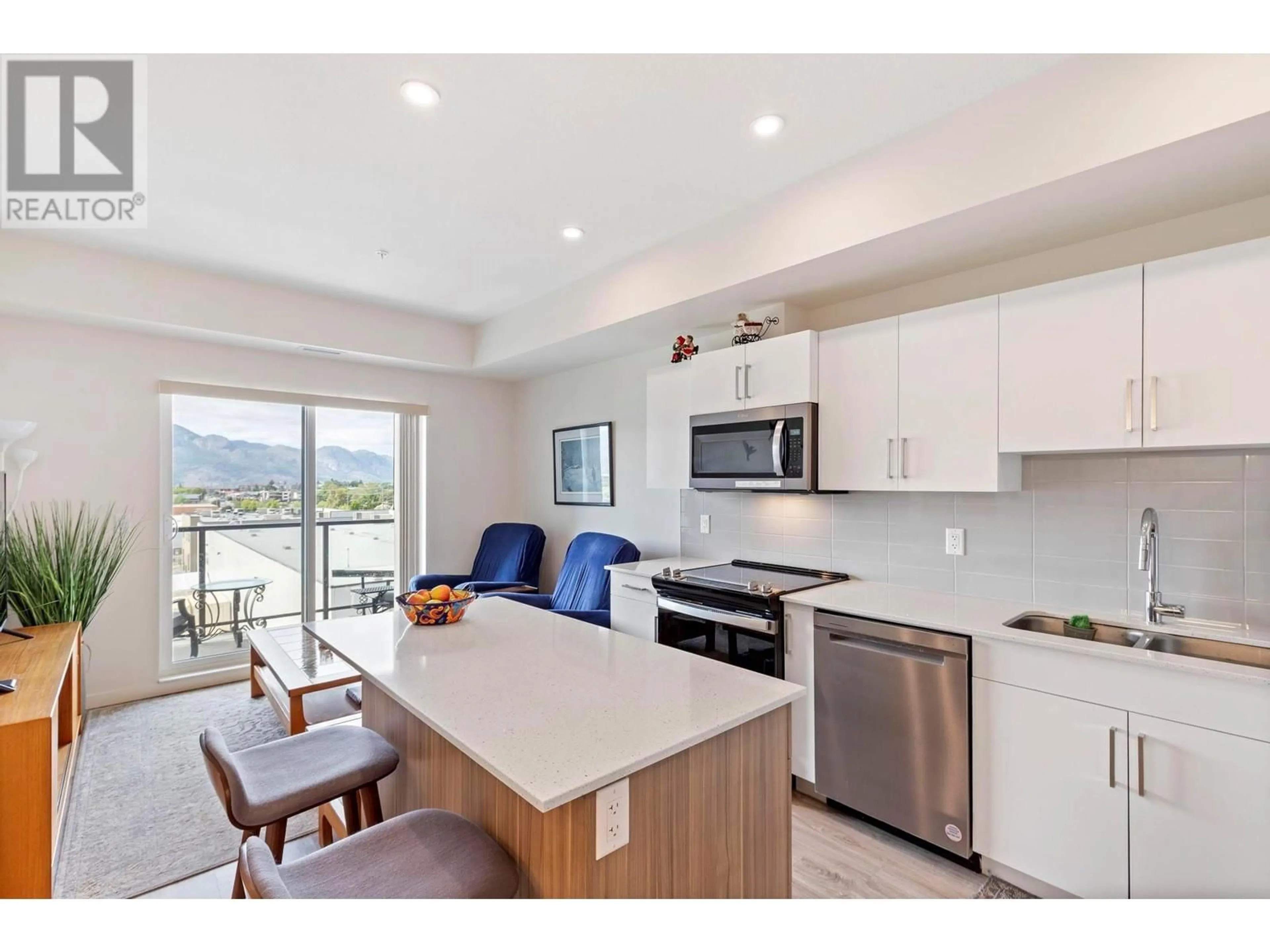 Open concept kitchen, wood/laminate floor for 416 - 2345 BUTT ROAD, West Kelowna British Columbia V4T0G2
