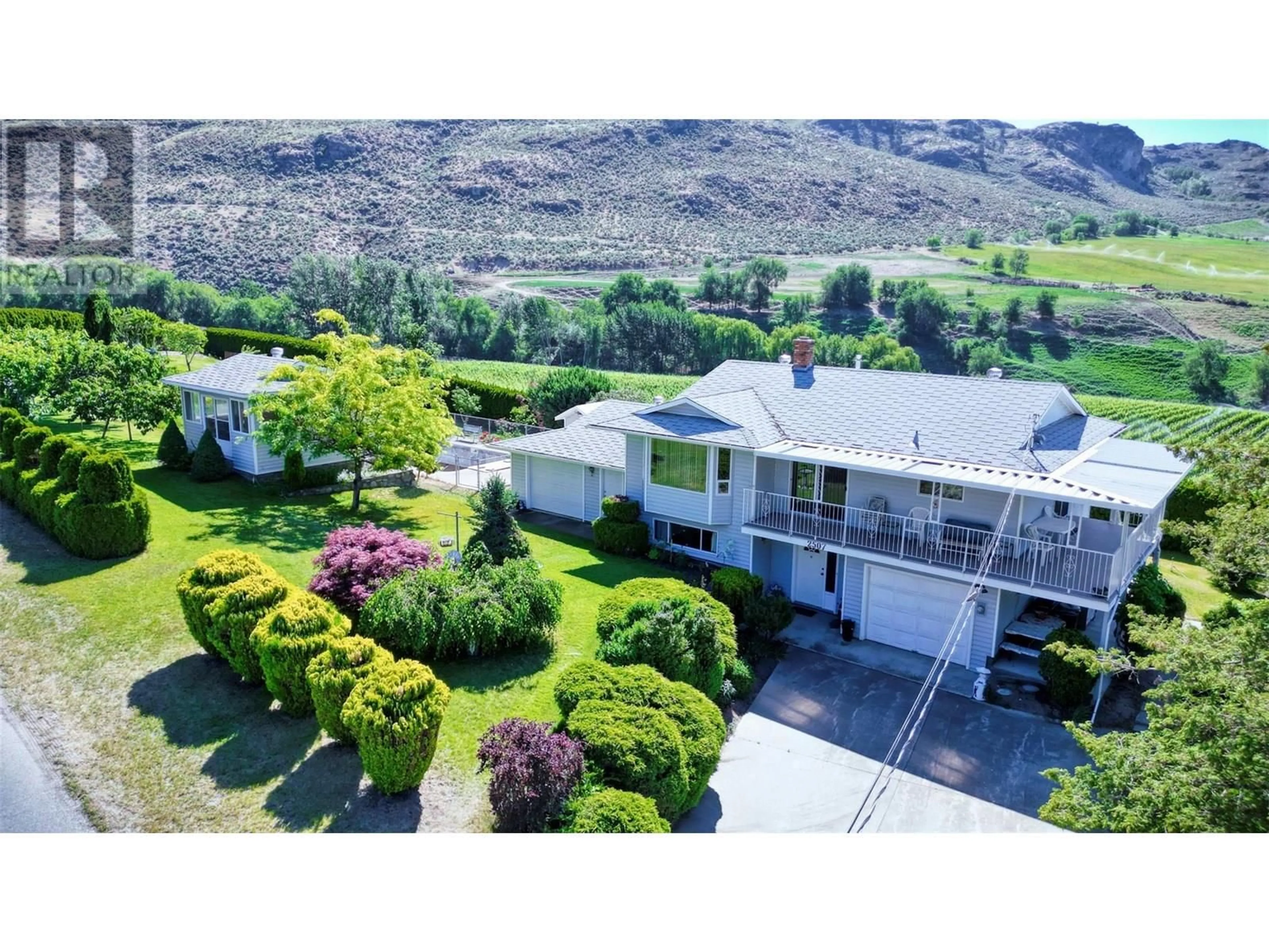 A pic from outside/outdoor area/front of a property/back of a property/a pic from drone, mountain view for 2507 30TH AVENUE, Osoyoos British Columbia V0H1V6