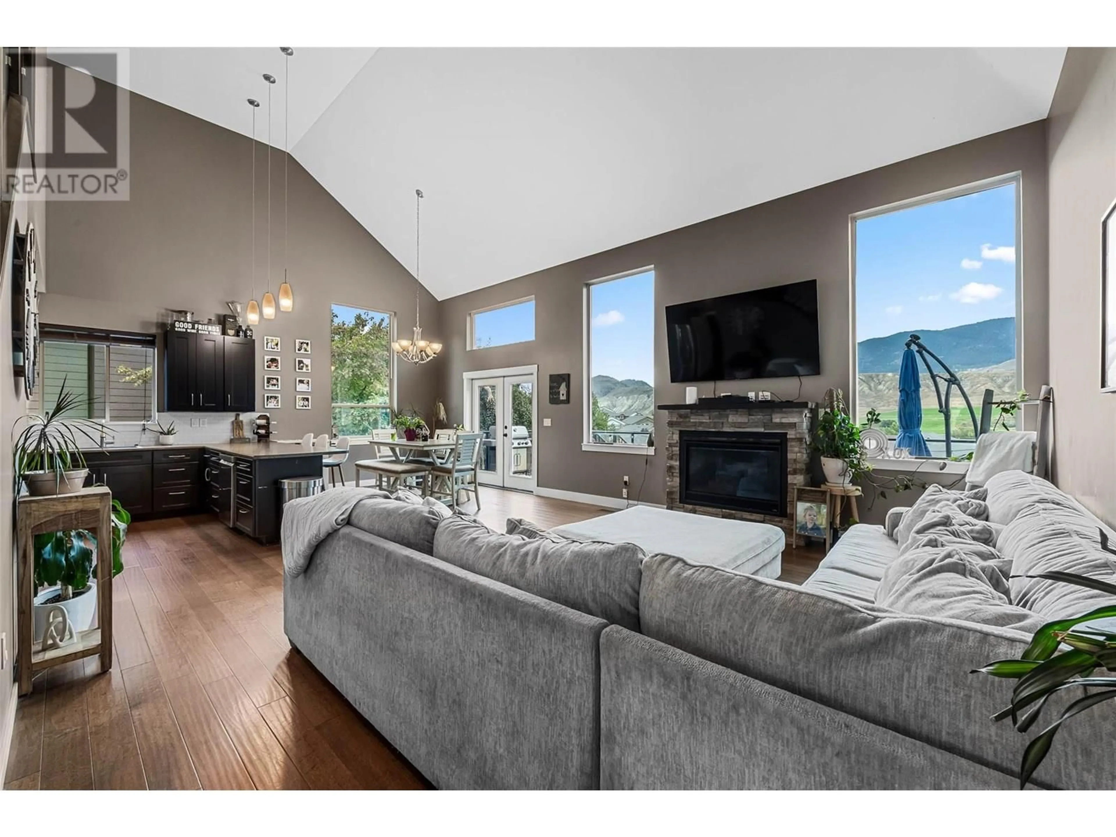 Living room with furniture, wood/laminate floor for 8774 BADGER DRIVE, Kamloops British Columbia V2C0B2