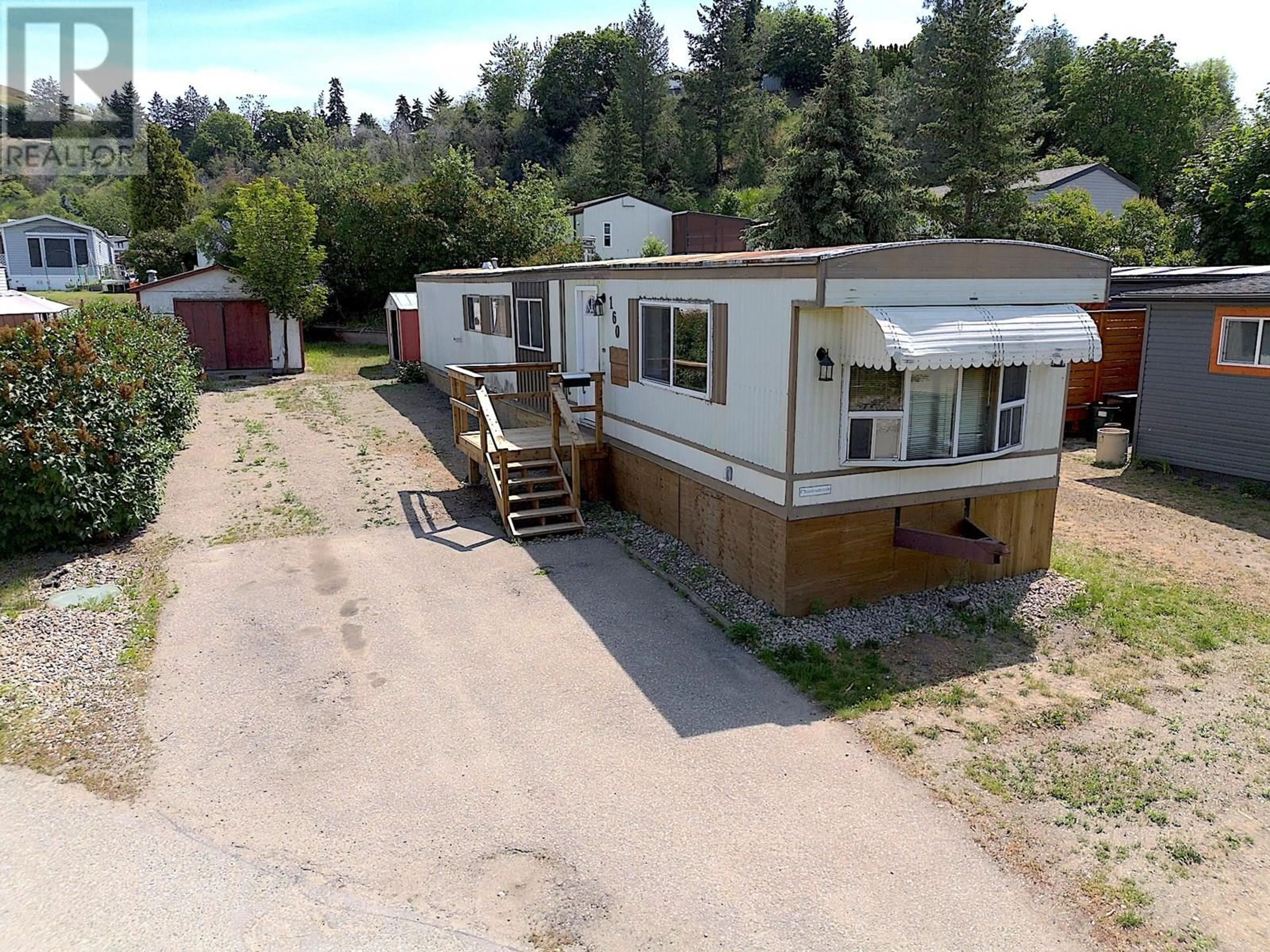 A pic from outside/outdoor area/front of a property/back of a property/a pic from drone, street for 160 - 15401 KALAMALKA ROAD, Coldstream British Columbia V1B1Z3