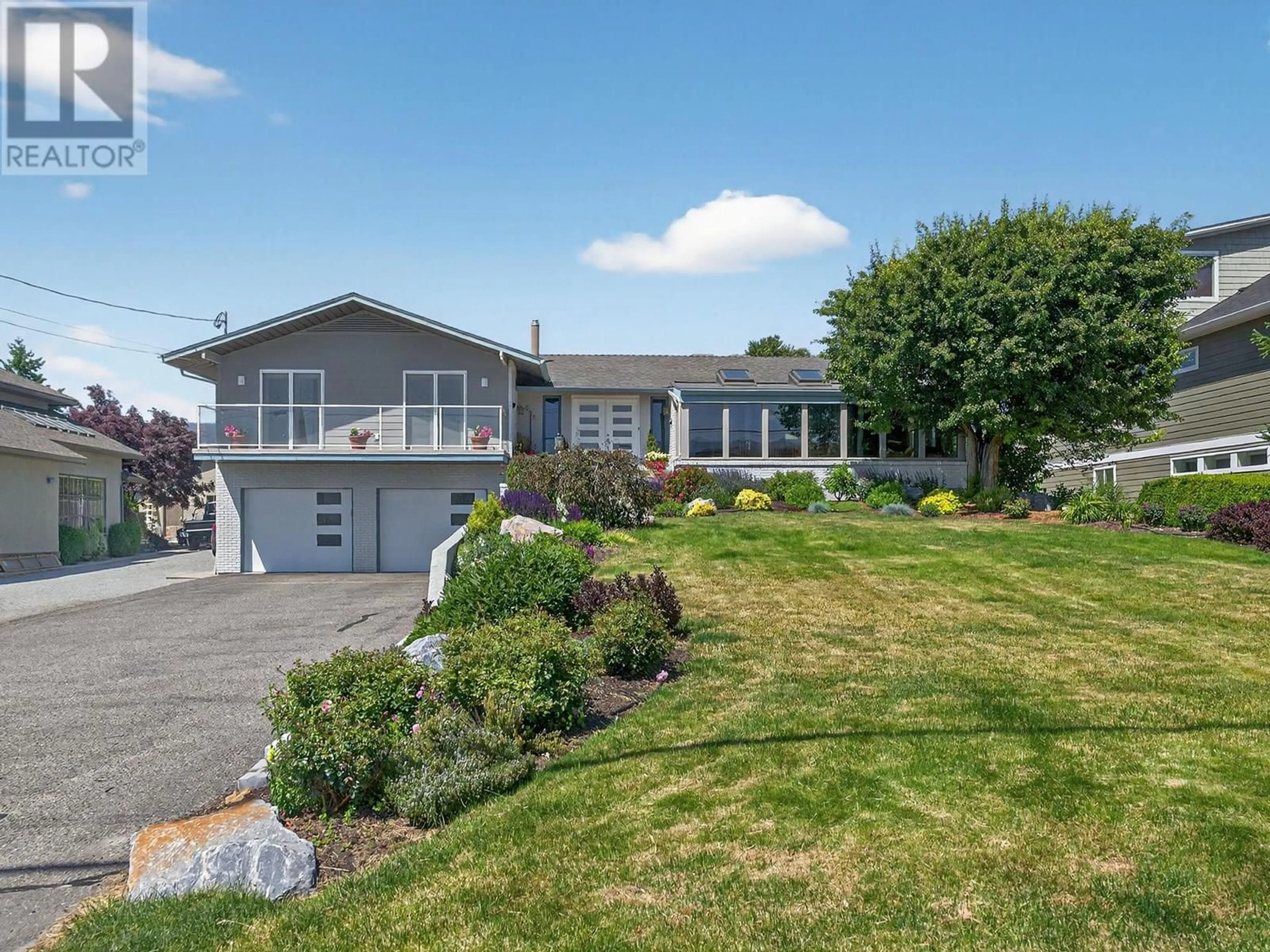 Home with vinyl exterior material, street for 832 MONTIGNY ROAD, West Kelowna British Columbia V1Z1S2