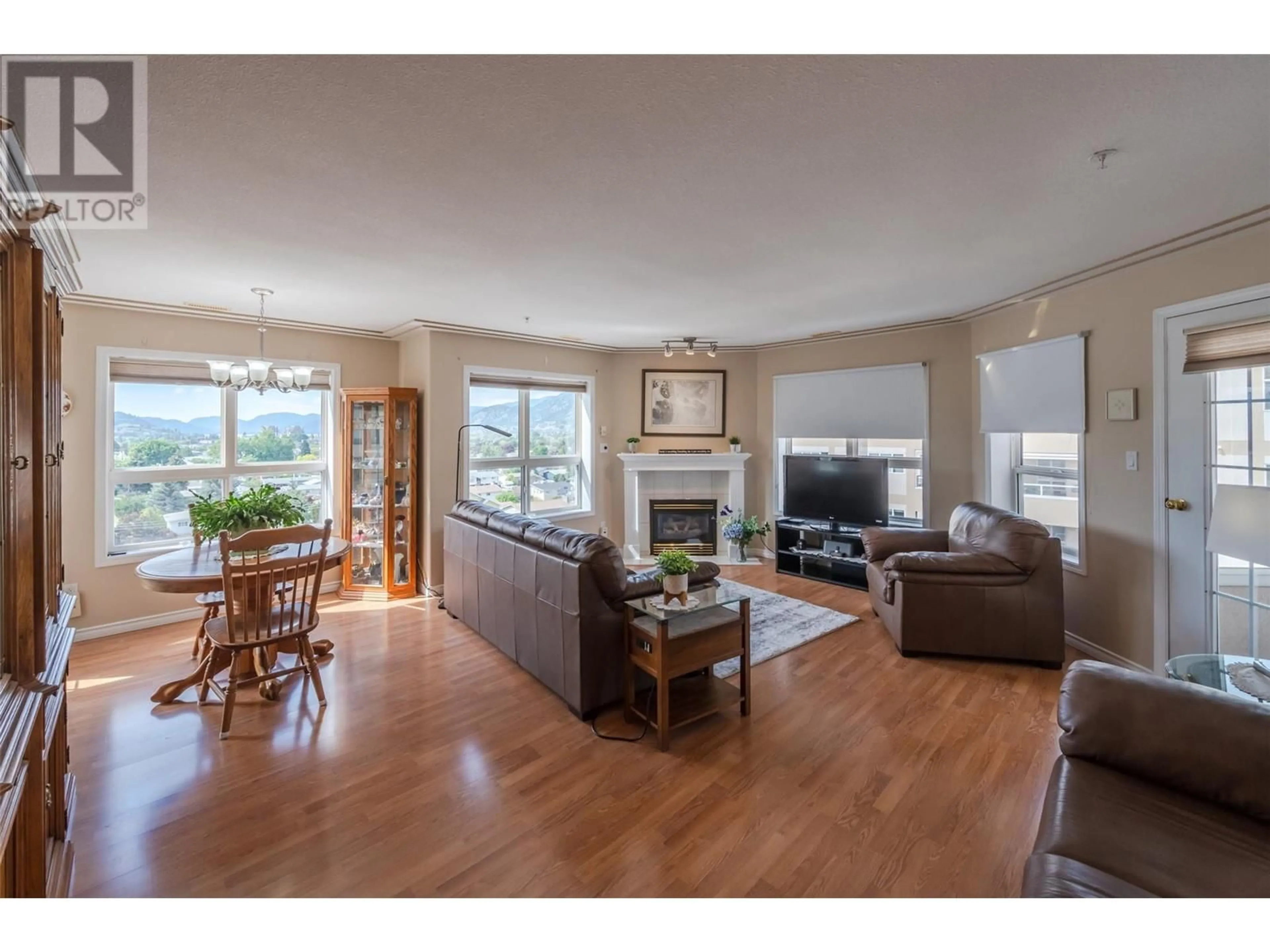 Living room with furniture, wood/laminate floor for 701 - 2275 ATKINSON STREET, Penticton British Columbia V2A8R7