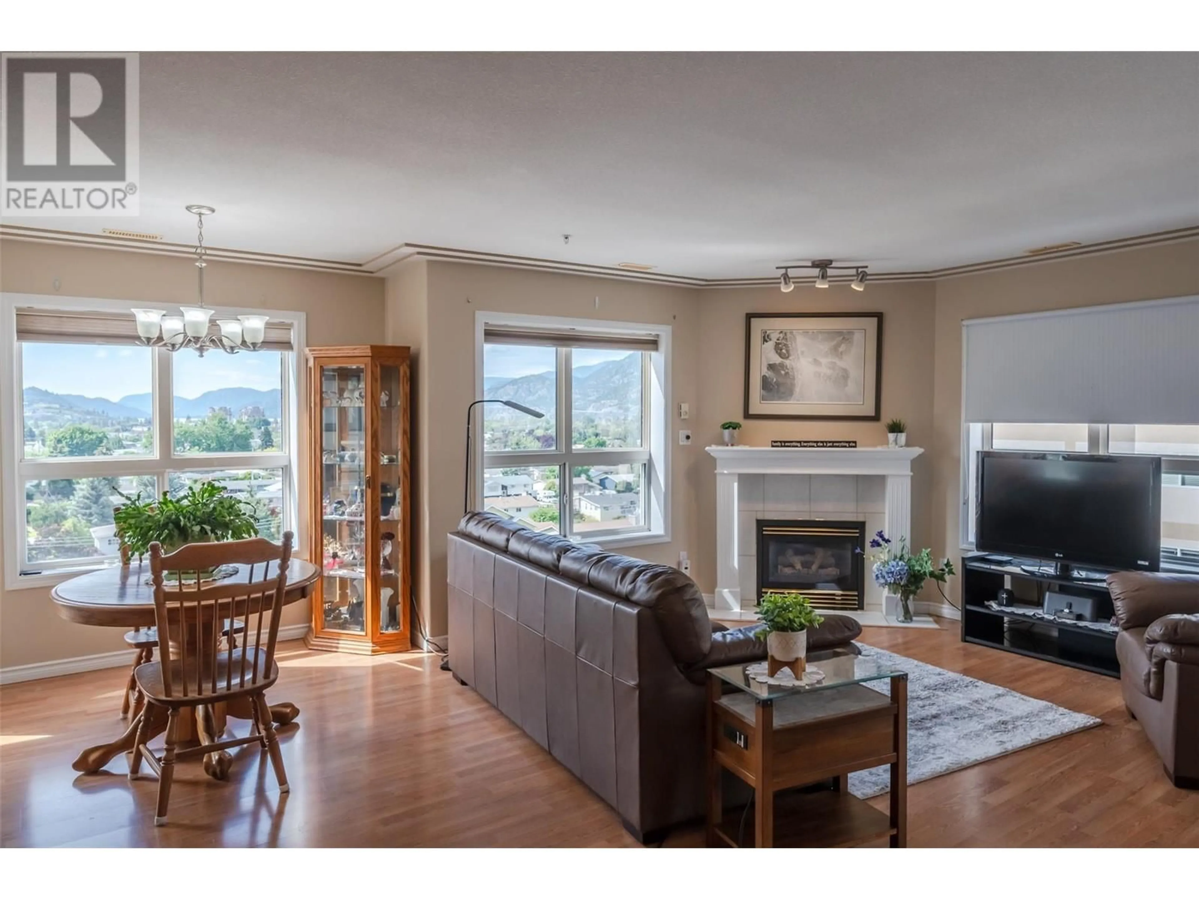 Living room with furniture, wood/laminate floor for 701 - 2275 ATKINSON STREET, Penticton British Columbia V2A8R7