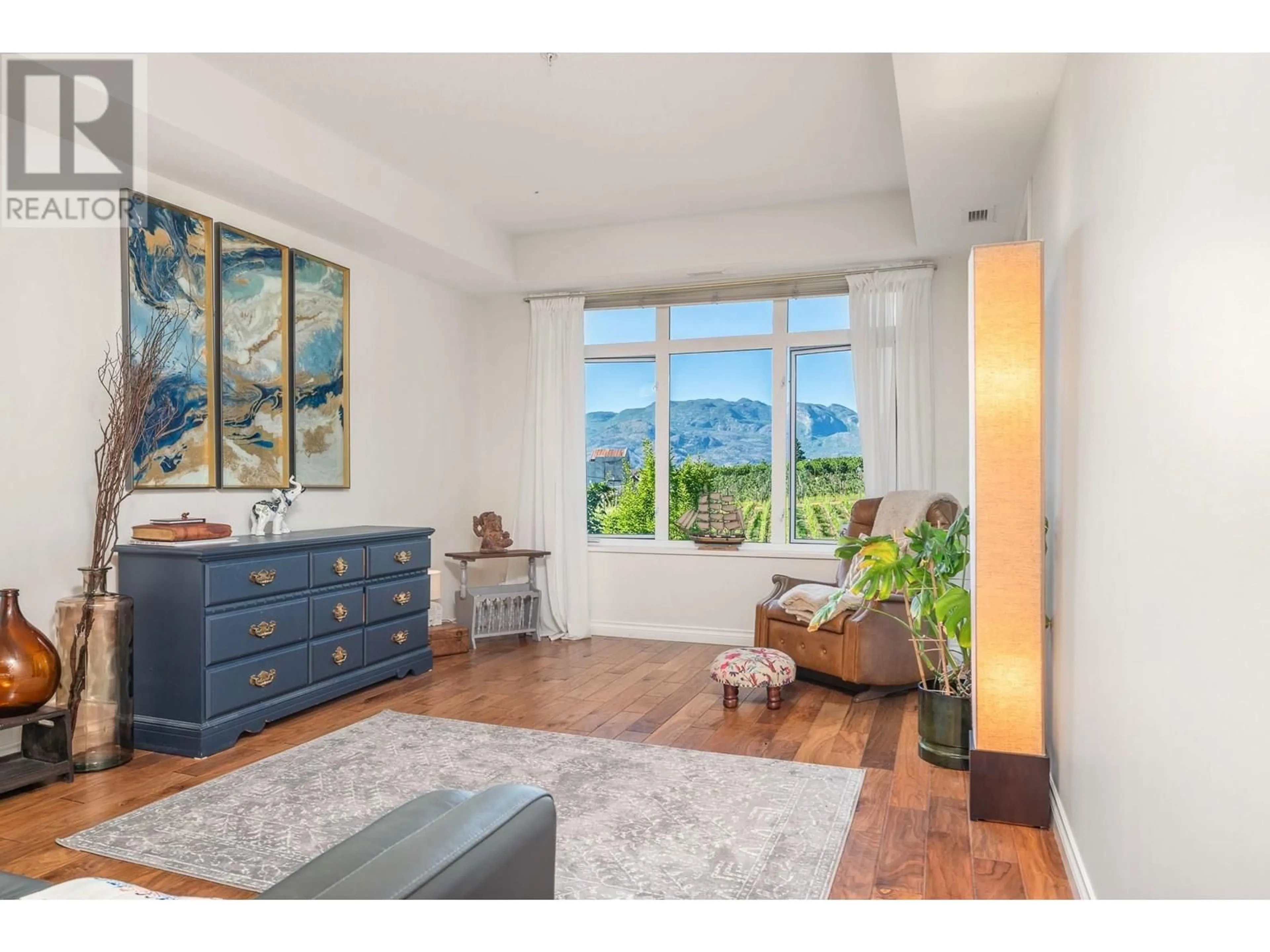 Living room with furniture, wood/laminate floor for 4212 - 3842 OLD OKANAGAN HIGHWAY, West Kelowna British Columbia V4T3G7