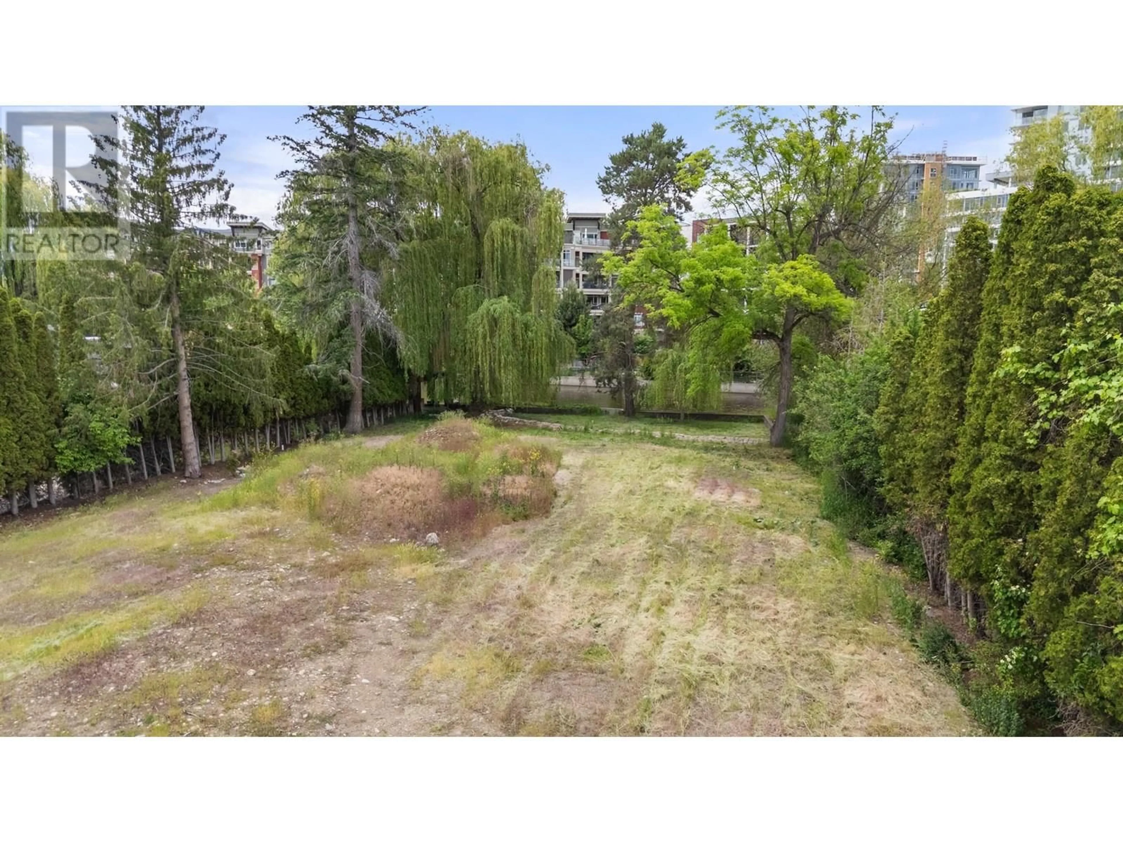 A pic from outside/outdoor area/front of a property/back of a property/a pic from drone, forest/trees view for 1 - 569 RADANT ROAD, Kelowna British Columbia V1W1A1