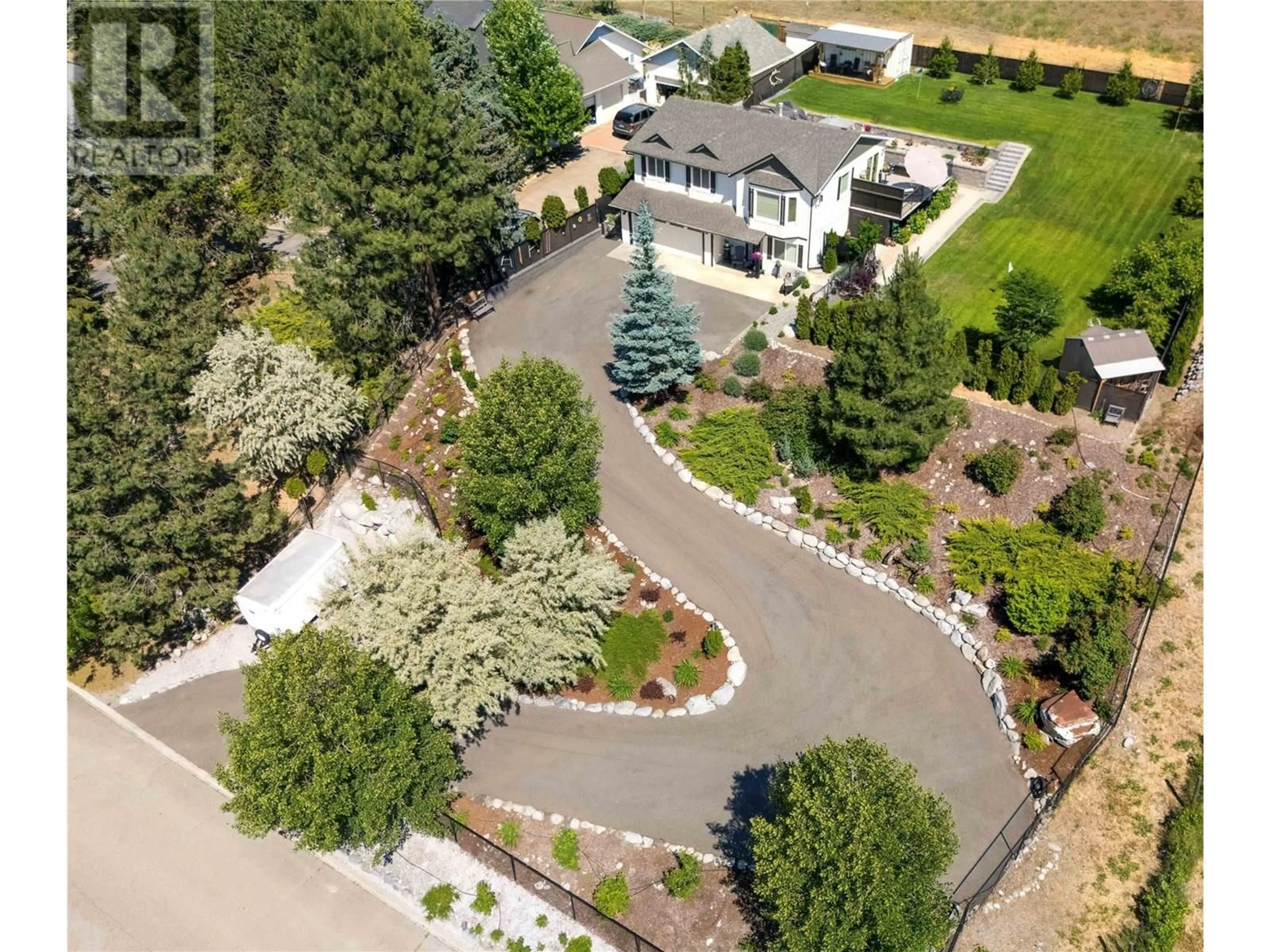 A pic from outside/outdoor area/front of a property/back of a property/a pic from drone, street for 4043 SMITH WAY, Peachland British Columbia V0H1X2