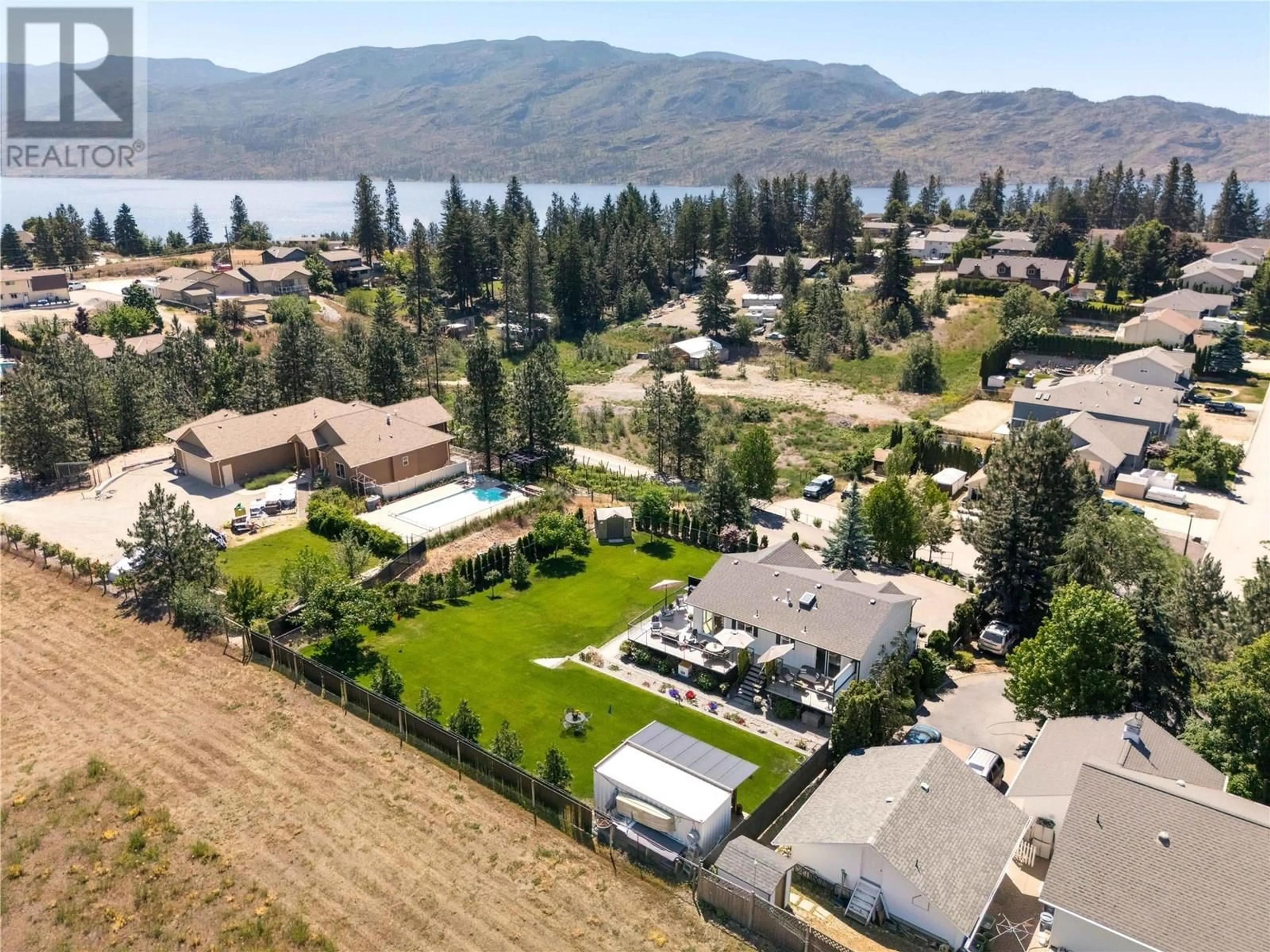 A pic from outside/outdoor area/front of a property/back of a property/a pic from drone, water/lake/river/ocean view for 4043 SMITH WAY, Peachland British Columbia V0H1X2