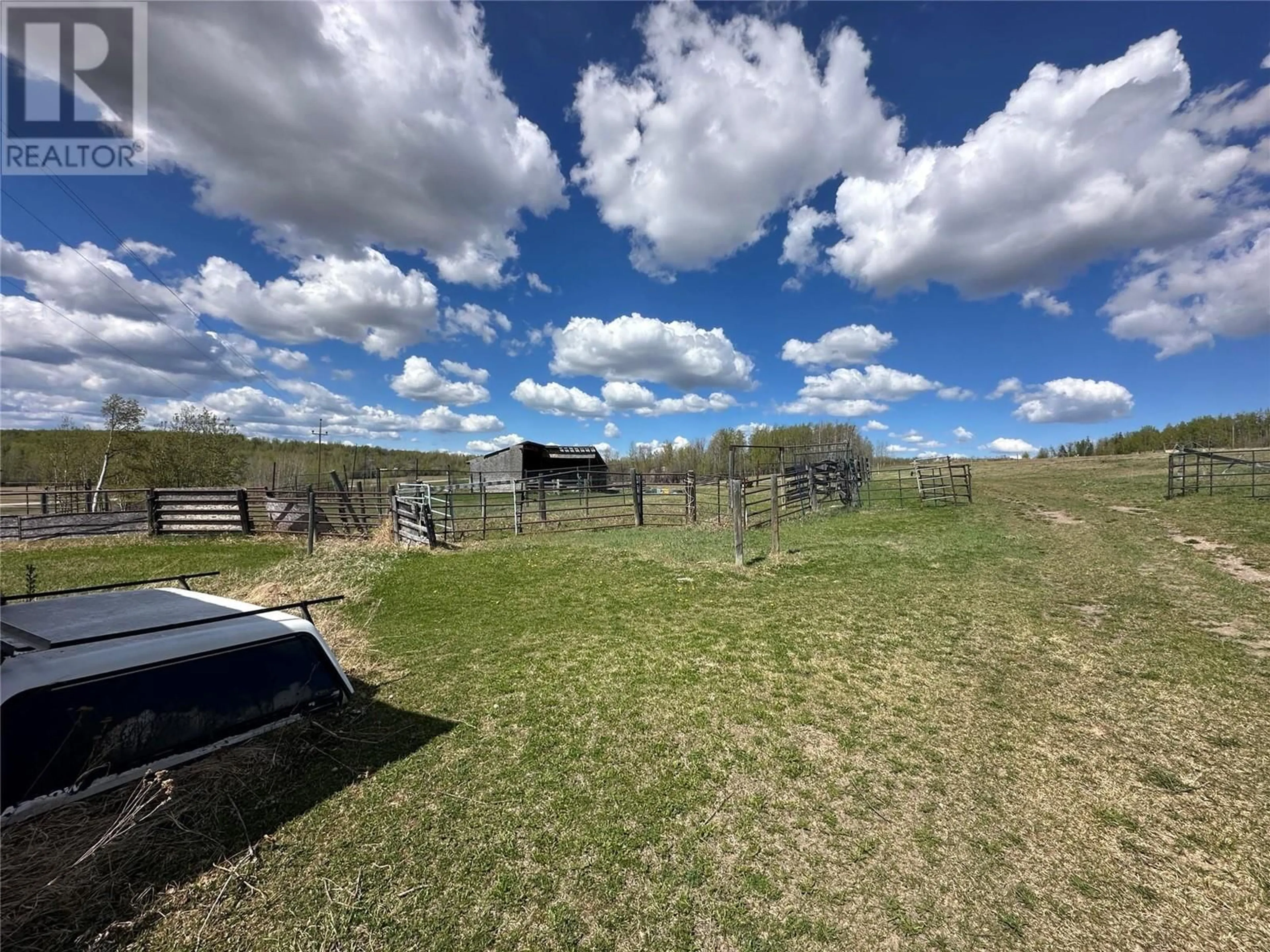 A pic from outside/outdoor area/front of a property/back of a property/a pic from drone, mountain view for 5420 224 ROAD, Dawson Creek British Columbia V1G0J4