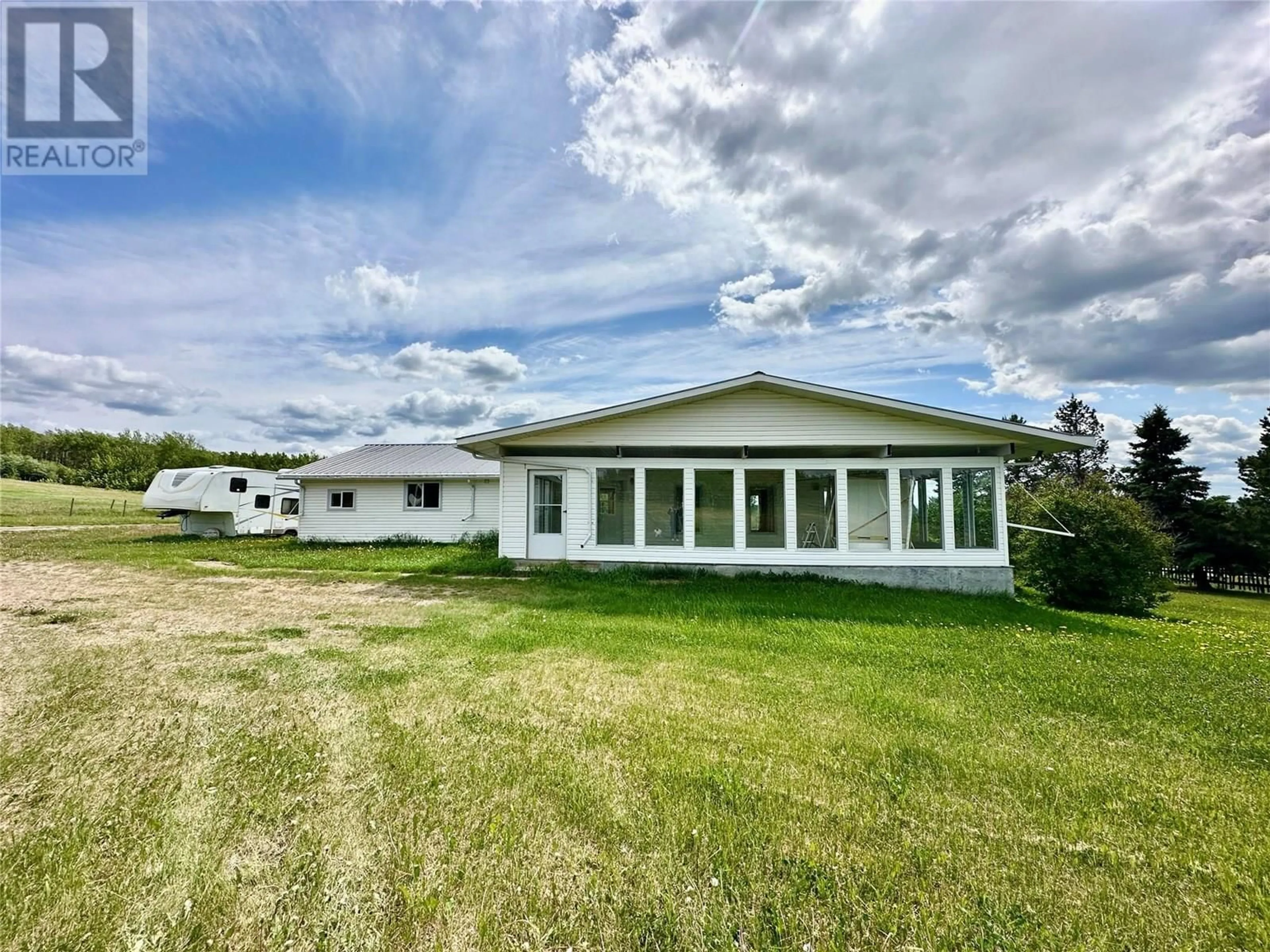 A pic from outside/outdoor area/front of a property/back of a property/a pic from drone, building for 5420 224 ROAD, Dawson Creek British Columbia V1G0J4