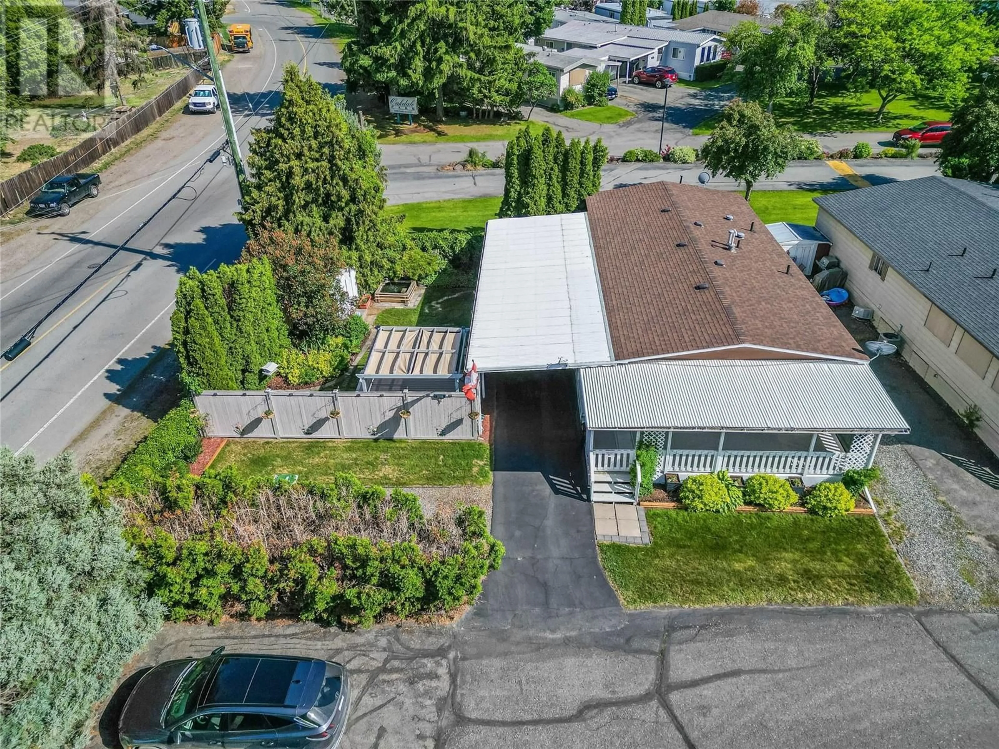 A pic from outside/outdoor area/front of a property/back of a property/a pic from drone, street for 228 - 2400 OAKDALE WAY, Kamloops British Columbia V2B6W7