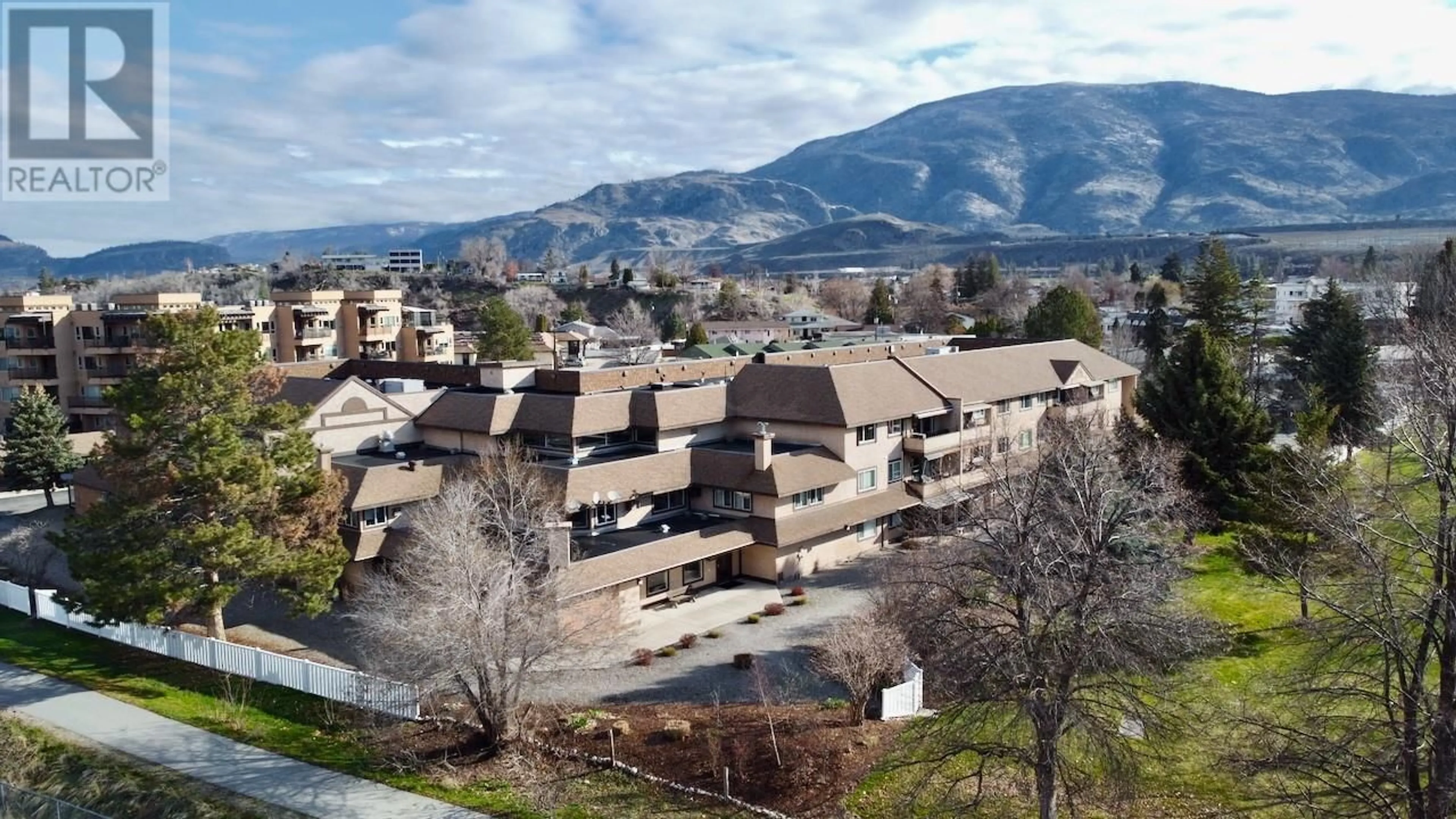 A pic from outside/outdoor area/front of a property/back of a property/a pic from drone, mountain view for 212 - 337 MCKINNEY ROAD, Oliver British Columbia V0H1T3