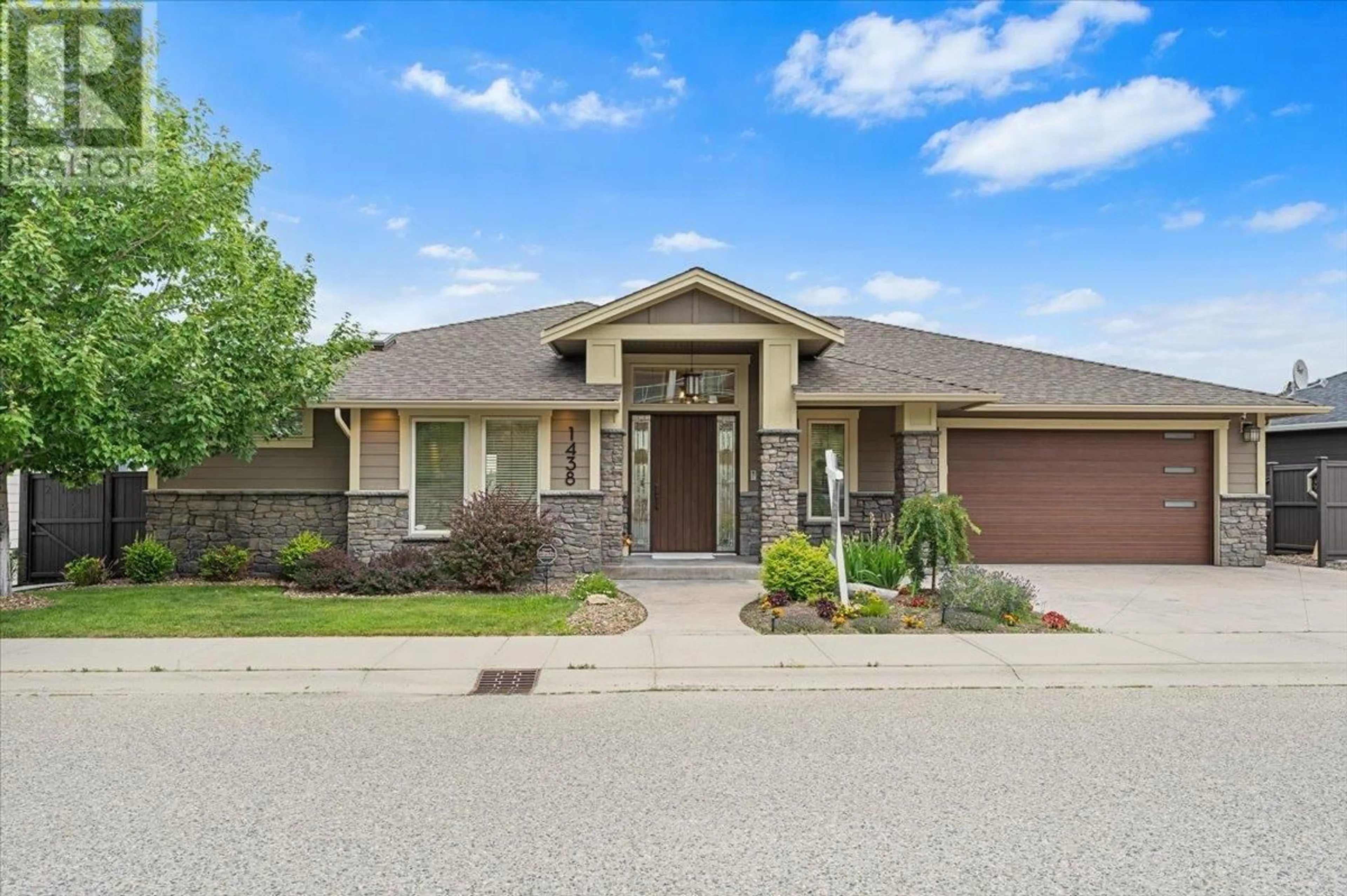 Home with brick exterior material, street for 1438 MONTENEGRO DRIVE, Kelowna British Columbia V1P1R3