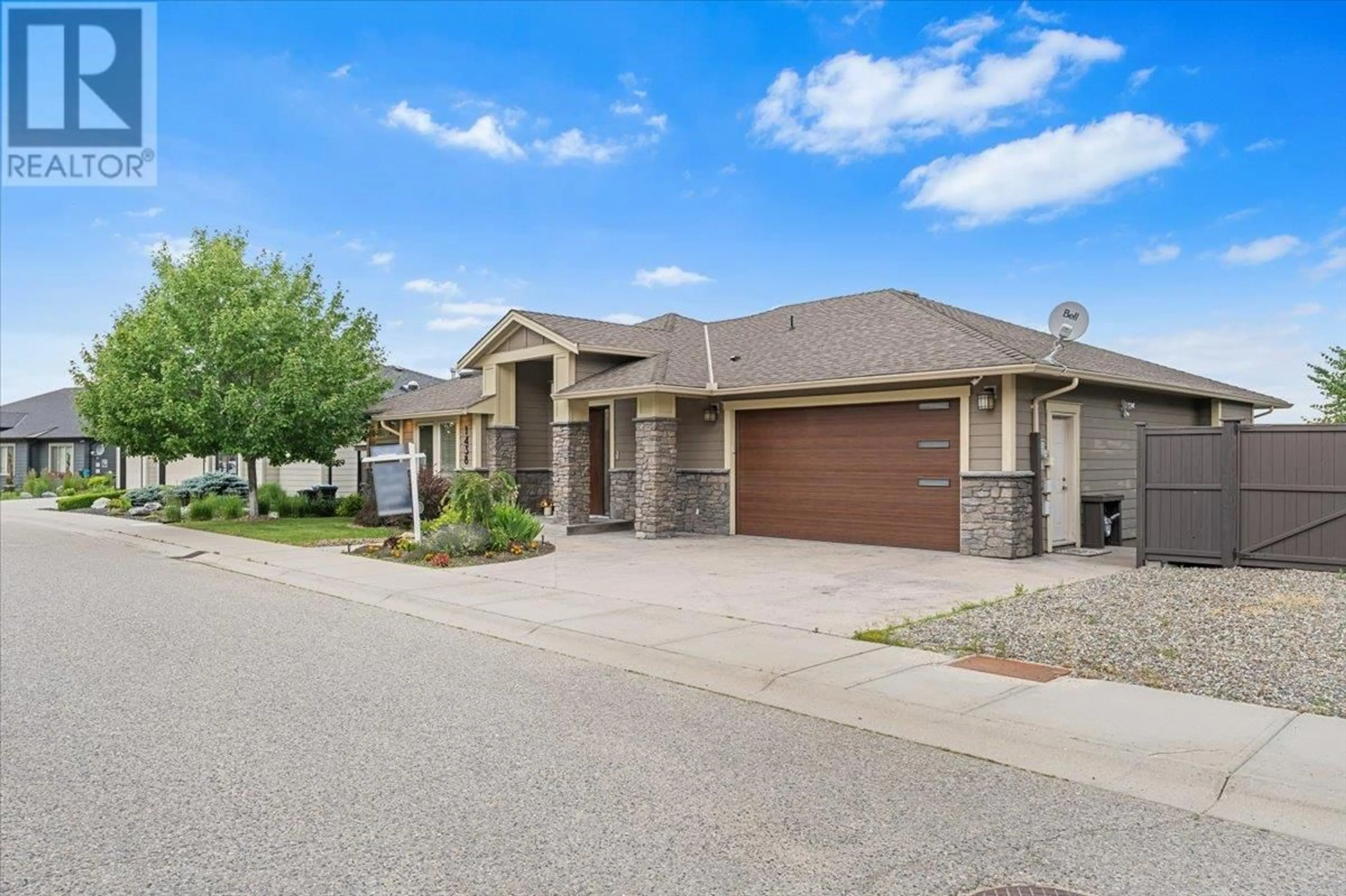 Home with brick exterior material, street for 1438 MONTENEGRO DRIVE, Kelowna British Columbia V1P1R3