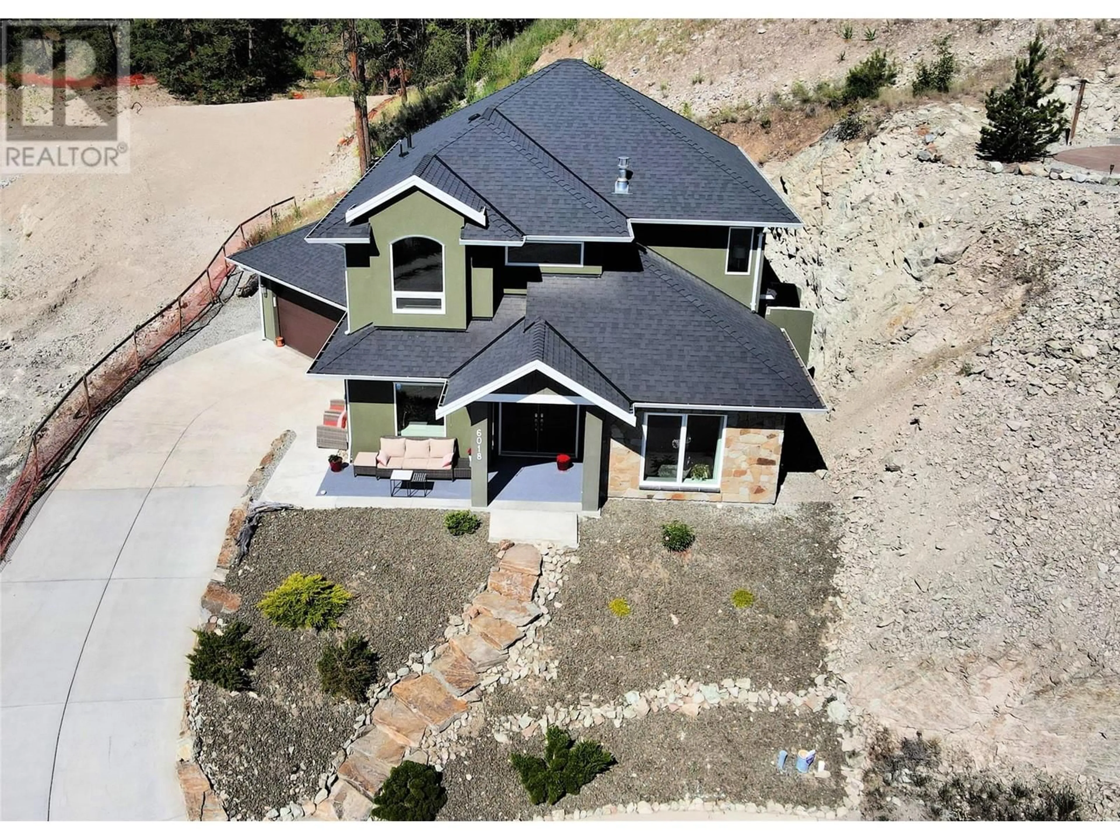 A pic from outside/outdoor area/front of a property/back of a property/a pic from drone, street for 6018 FULKS ROAD, Peachland British Columbia V0H1X4