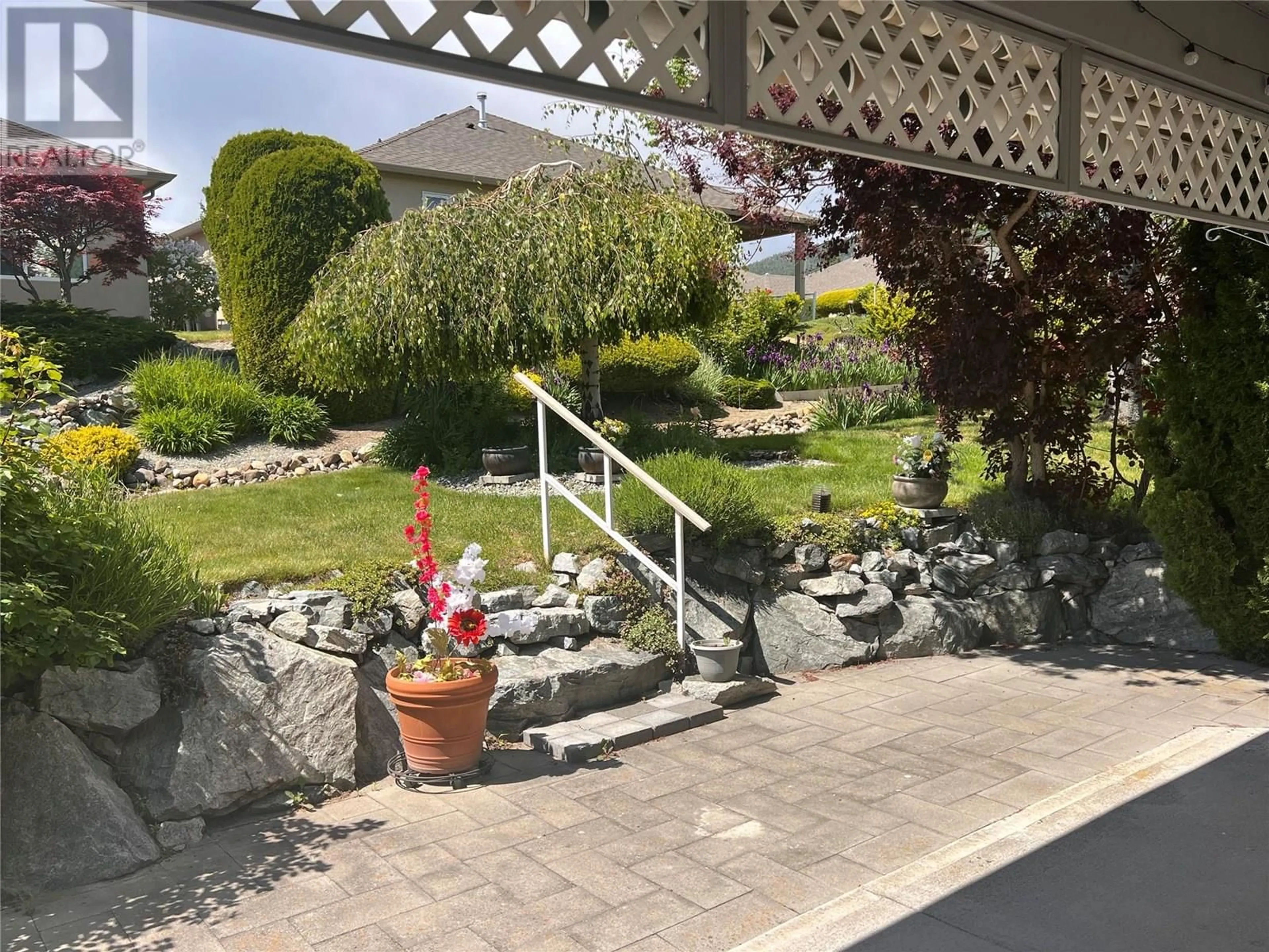 A pic from outside/outdoor area/front of a property/back of a property/a pic from drone, street for 204 - 3360 OLD OKANAGAN HIGHWAY, West Kelowna British Columbia V4T1X9