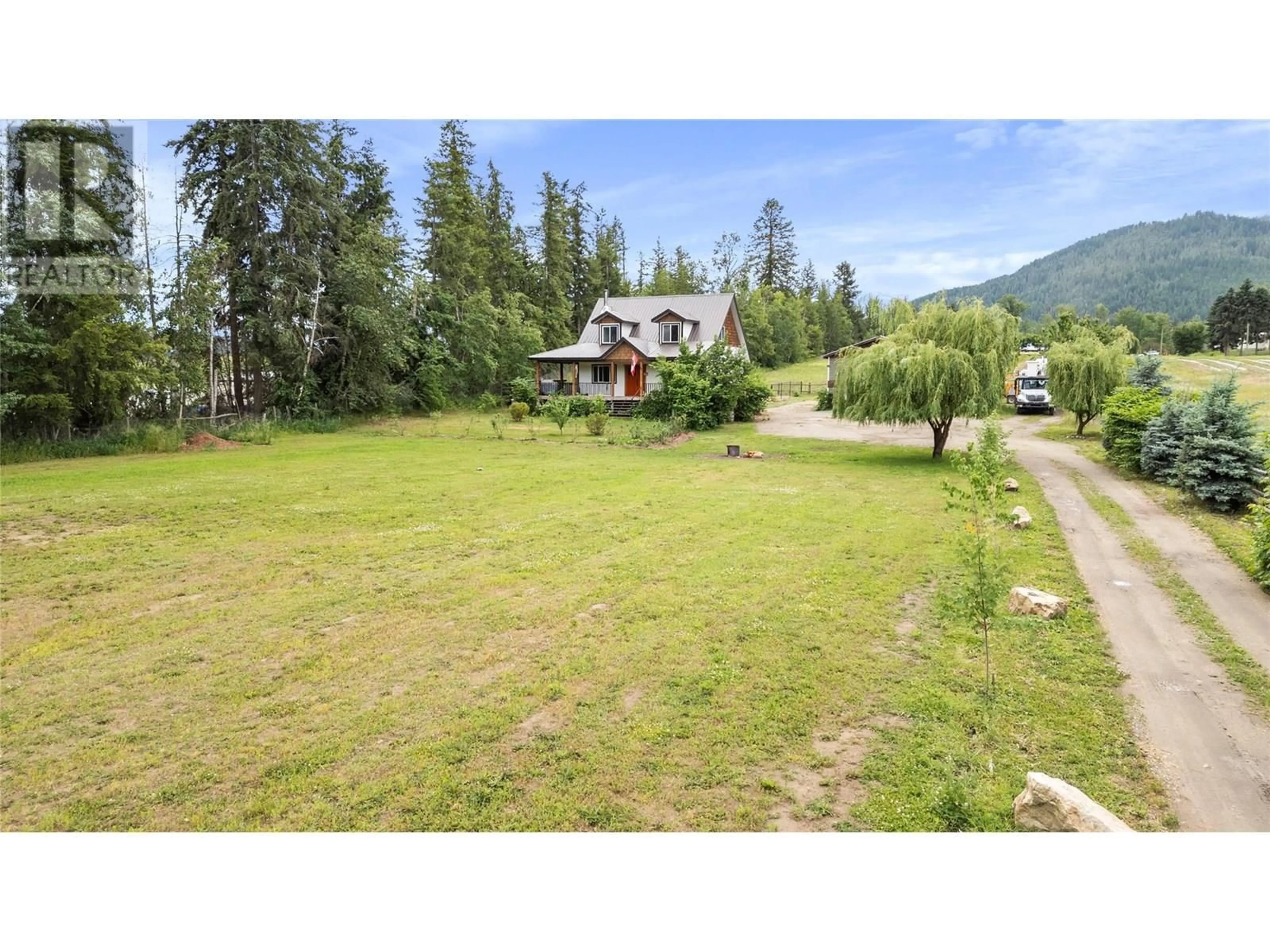 A pic from outside/outdoor area/front of a property/back of a property/a pic from drone, mountain view for 4150 20 AVENUE SOUTHEAST, Salmon Arm British Columbia V1E1X9