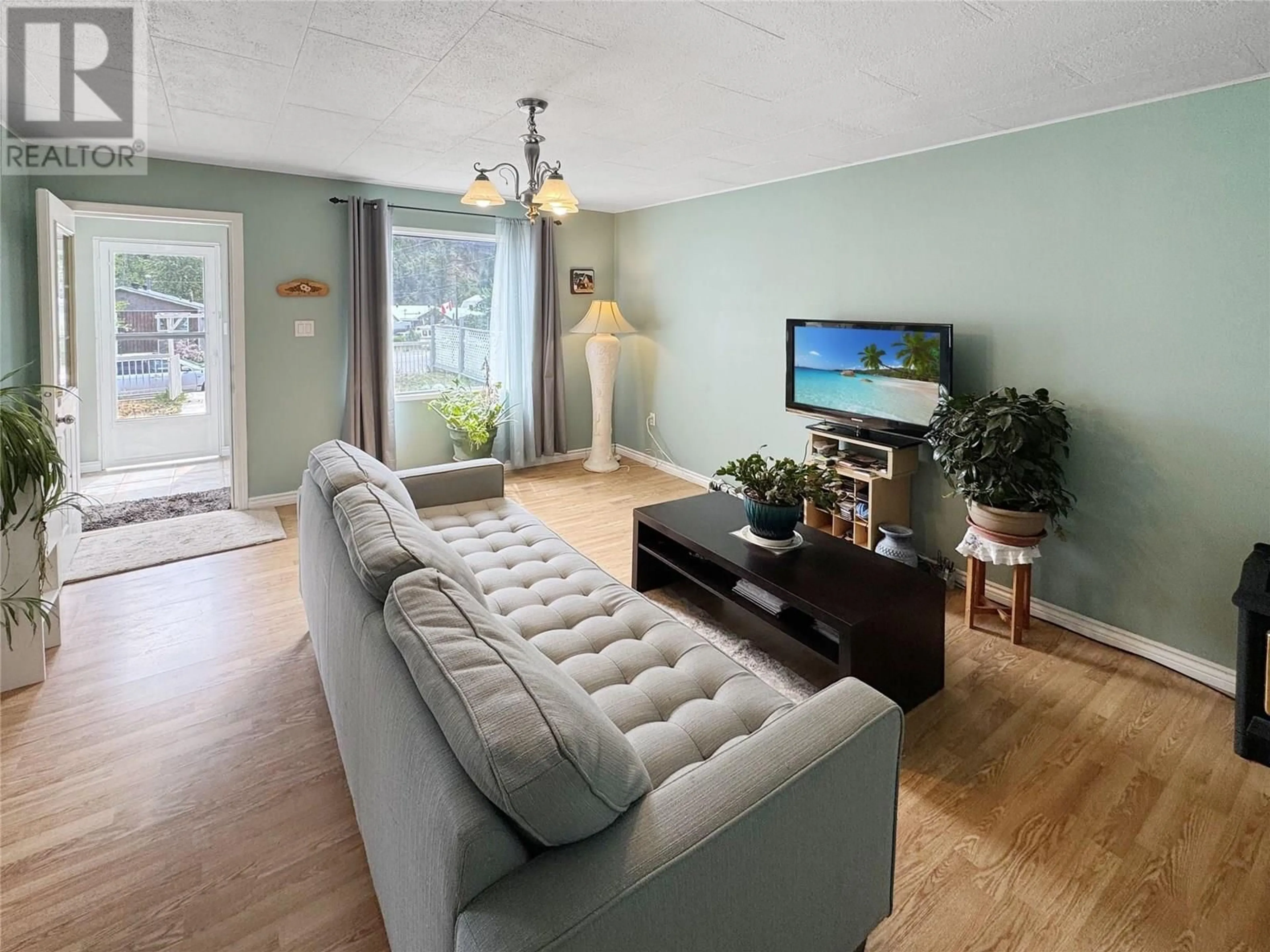 Living room with furniture, wood/laminate floor for 297 LACHINE AVENUE, Princeton British Columbia V0X1W0